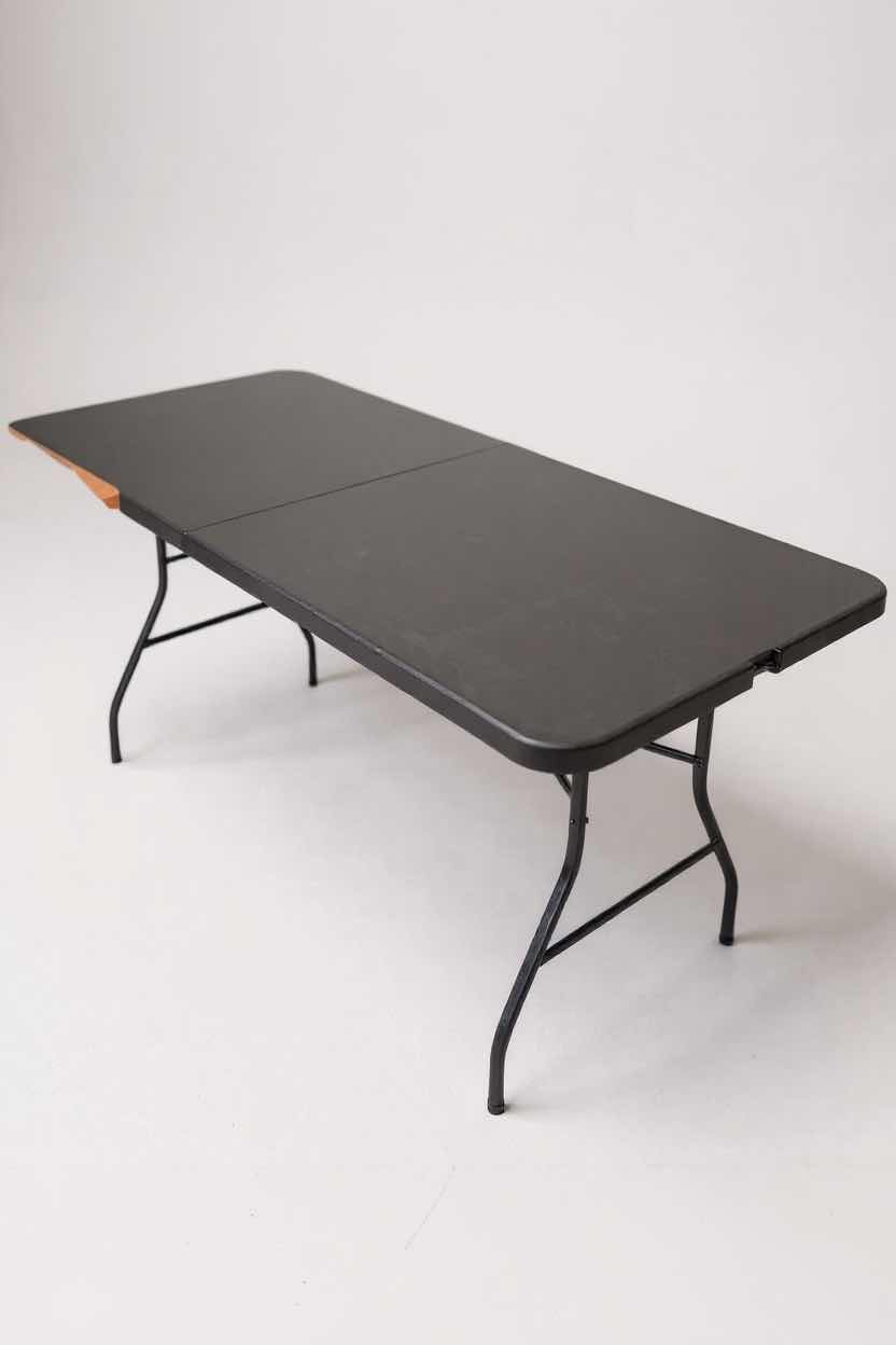 Photo 1 of LONG BLACK FOLDING TABLE 71" X 29"