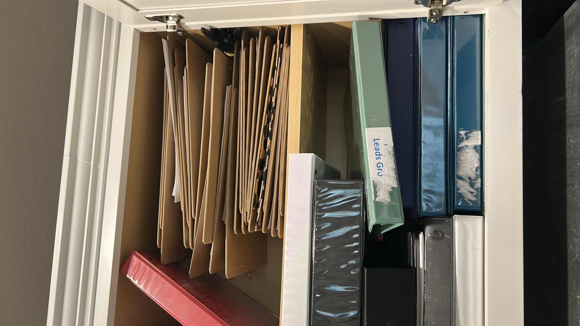 Photo 1 of CONTENTS OF CABINET ASSORTED BINDERS