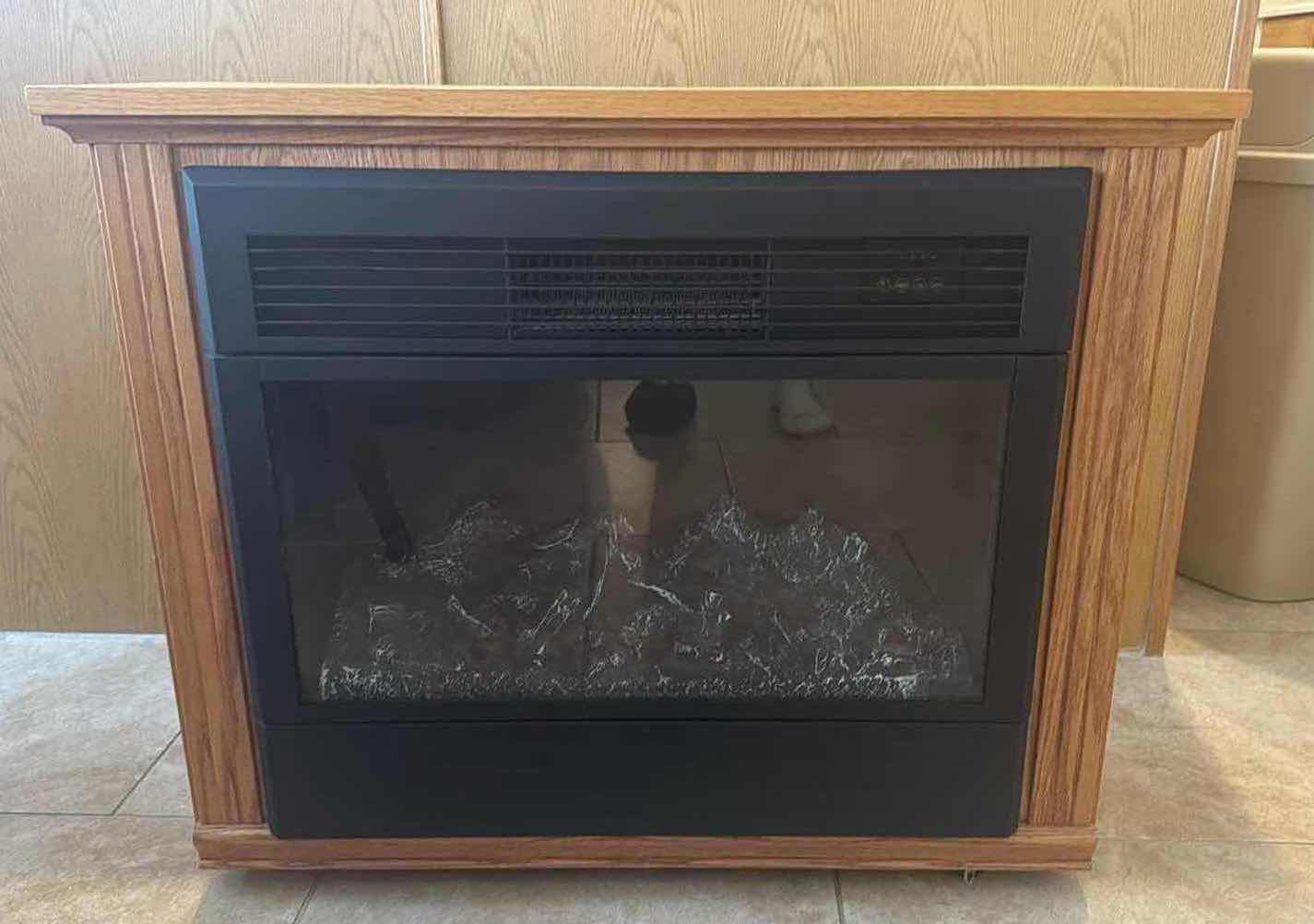 Photo 1 of HEAT SURGE ELECTRIC PORTABLE FIREPLACE IN WOOD CABINET 32”x12” H36”