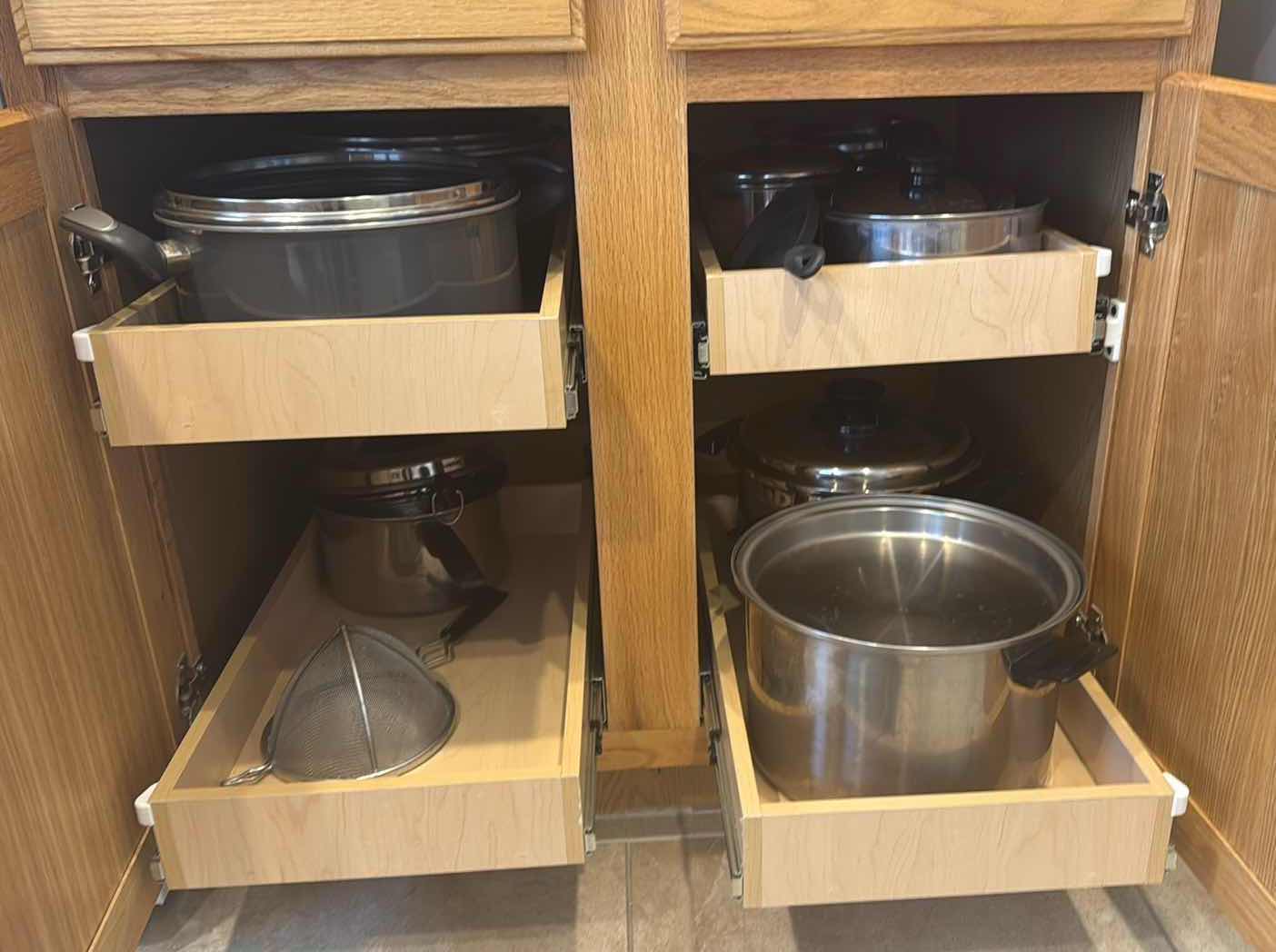 Photo 1 of CONTENTS OF KITCHEN CABINET-POTS & PANS