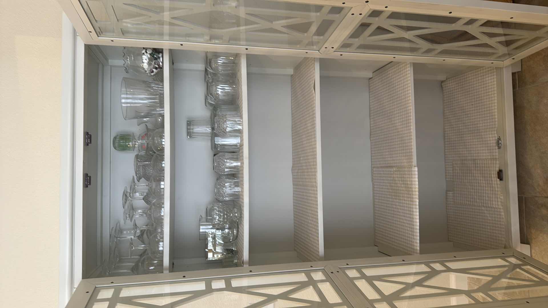 Photo 1 of WHITE WOODEN CURIO DISPLAY CABINET W. CONTENTS W GEOMETRIC OVERLAY 35” x 16” H68”