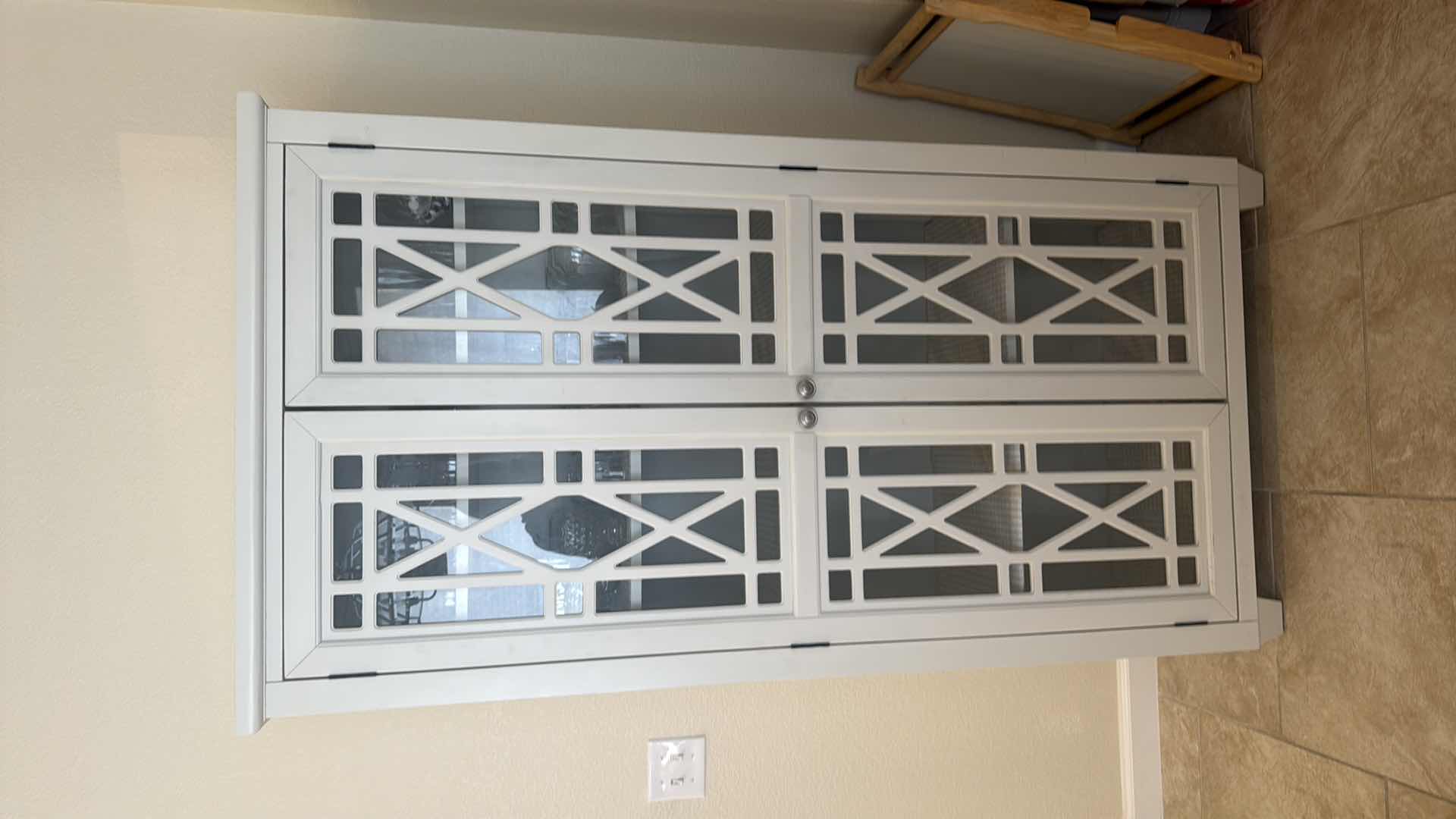 Photo 1 of WHITE WOODEN CURIO DISPLAY CABINET W. CONTENTS W GEOMETRIC OVERLAY 35” x 16” H68”