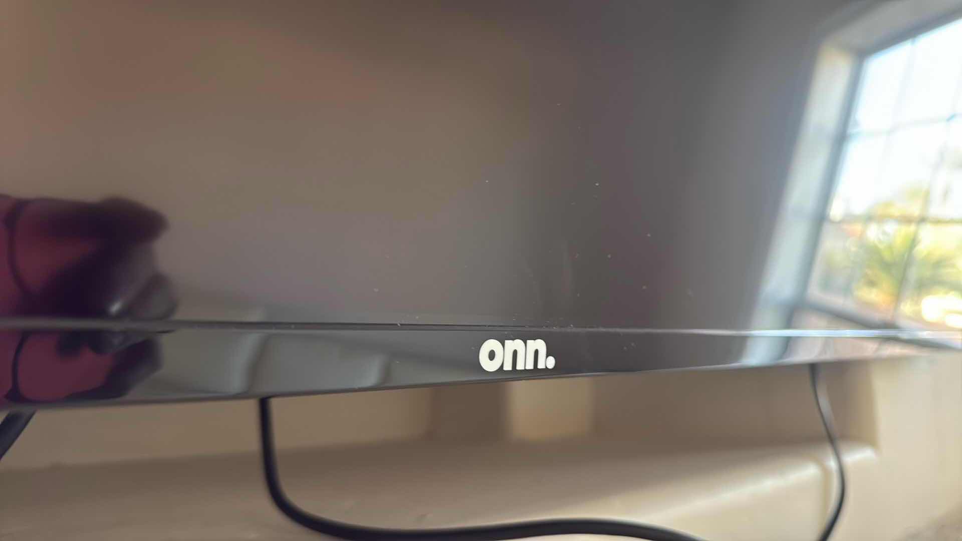 Photo 1 of 75” ROKU FLATSCREEN TV W WALL BRACKET & REMOTE