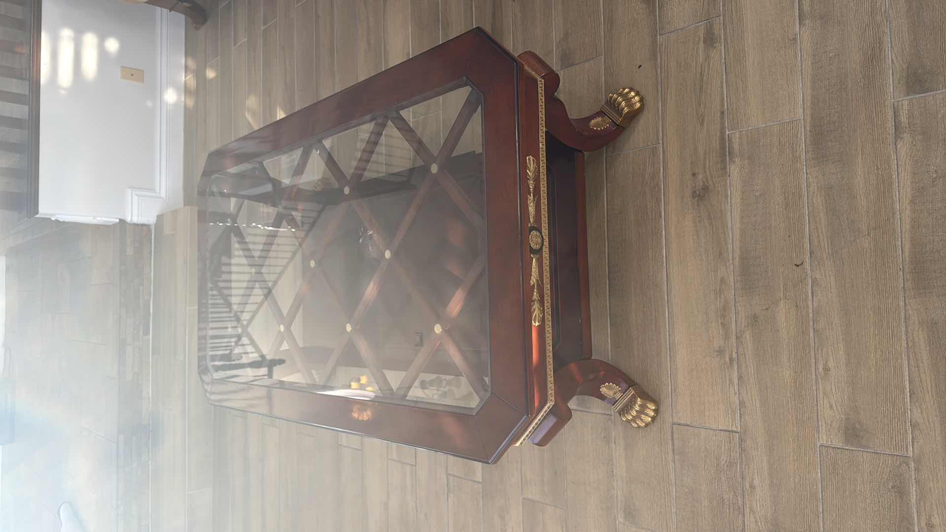 Photo 1 of VERSACE-STYLE SOLID WOOD COFFEE TABLE W GLASS TOP & GOLD TRIMMINGS 59” x 33” H19"