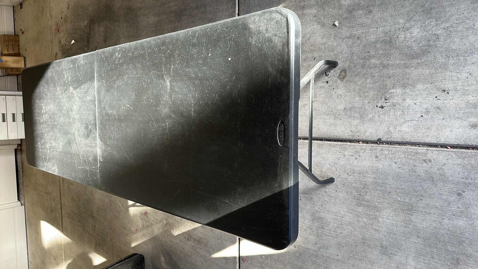 Photo 1 of 8' COSCO BLACK UTILITY FOLDING TABLE