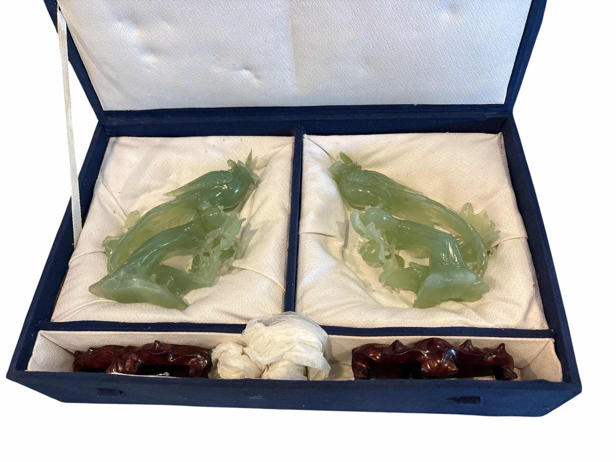 Photo 1 of (2)PCS JADEITE BIRD FIGURINES ON HAND CARVED TRUNK AND WOODEN BASE IN PROTECTIVE BOX H7.02”