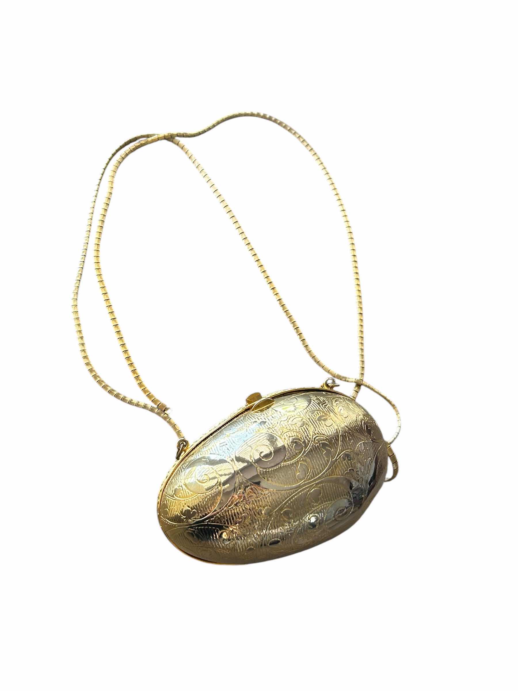 Photo 1 of VINTAGE GOLD METAL EGG SHAPED CLUTCH
