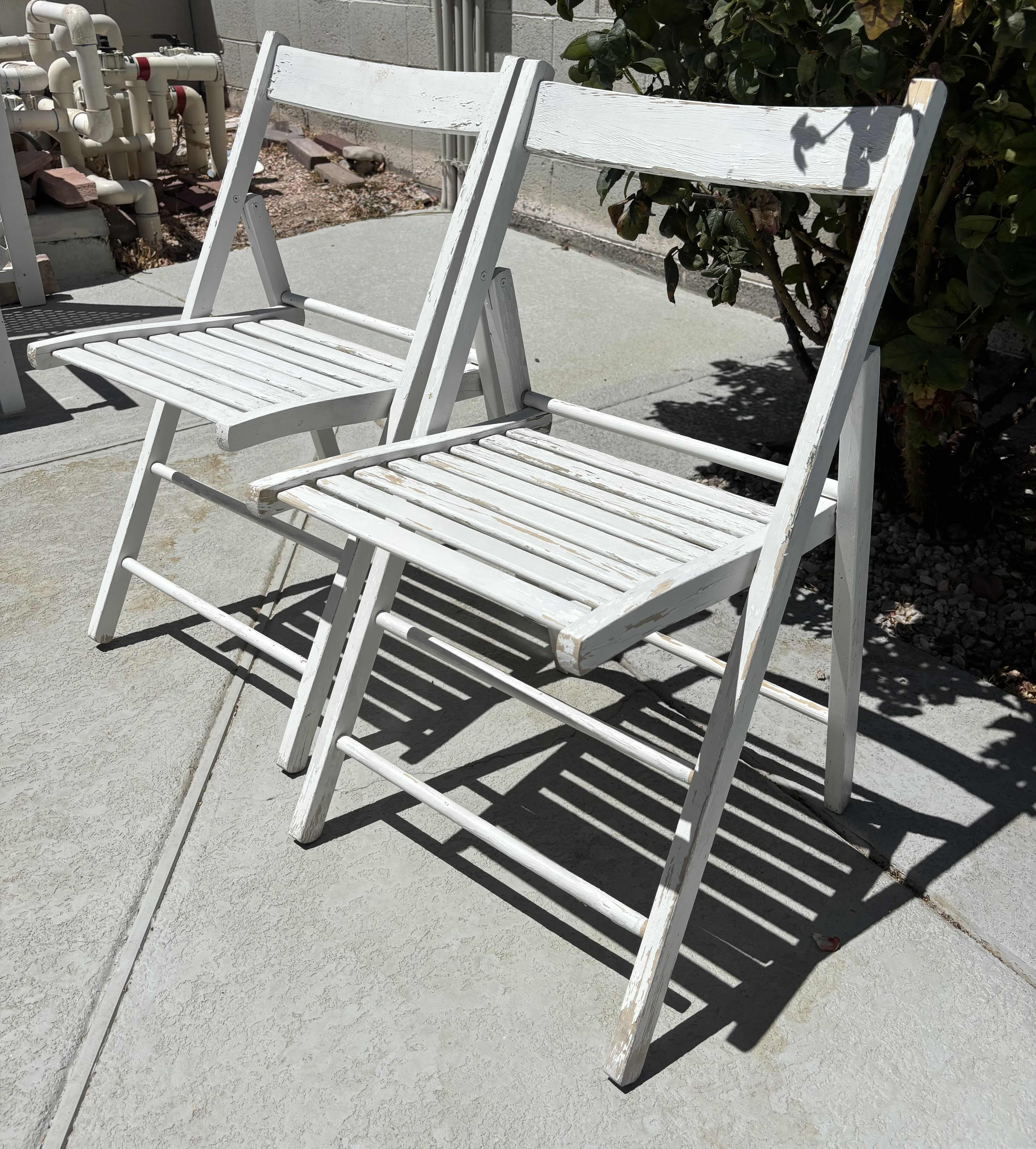 Photo 1 of OUTDOOR WOODEN FOLDING CHAIRS (2) H31”