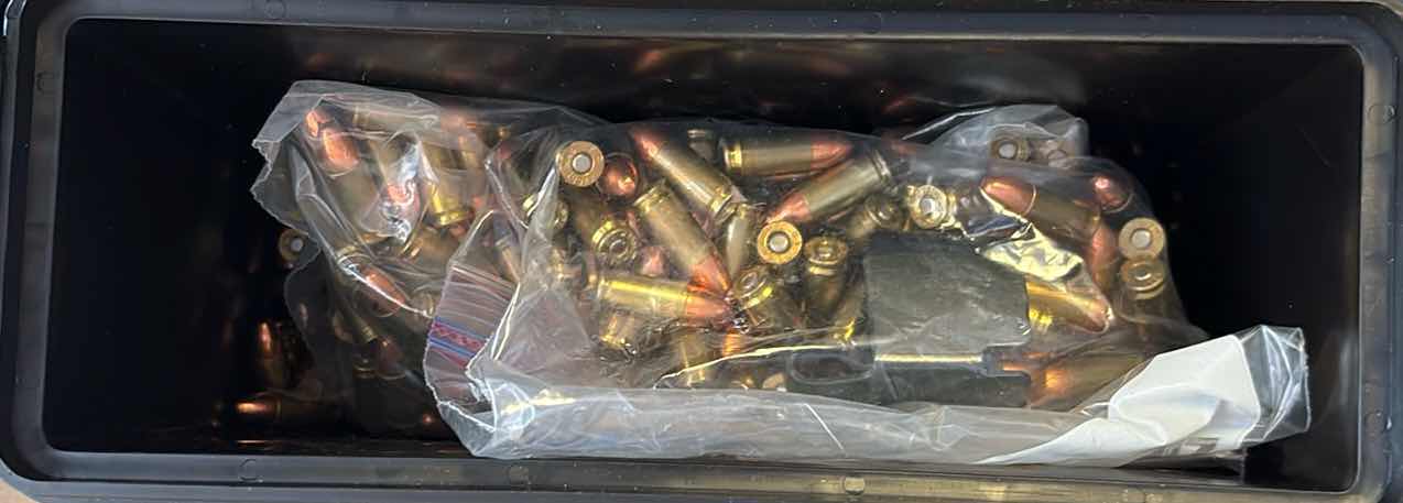 Photo 1 of SMALL SAFETY CONTAINER OF AMMO 9MM LUGER