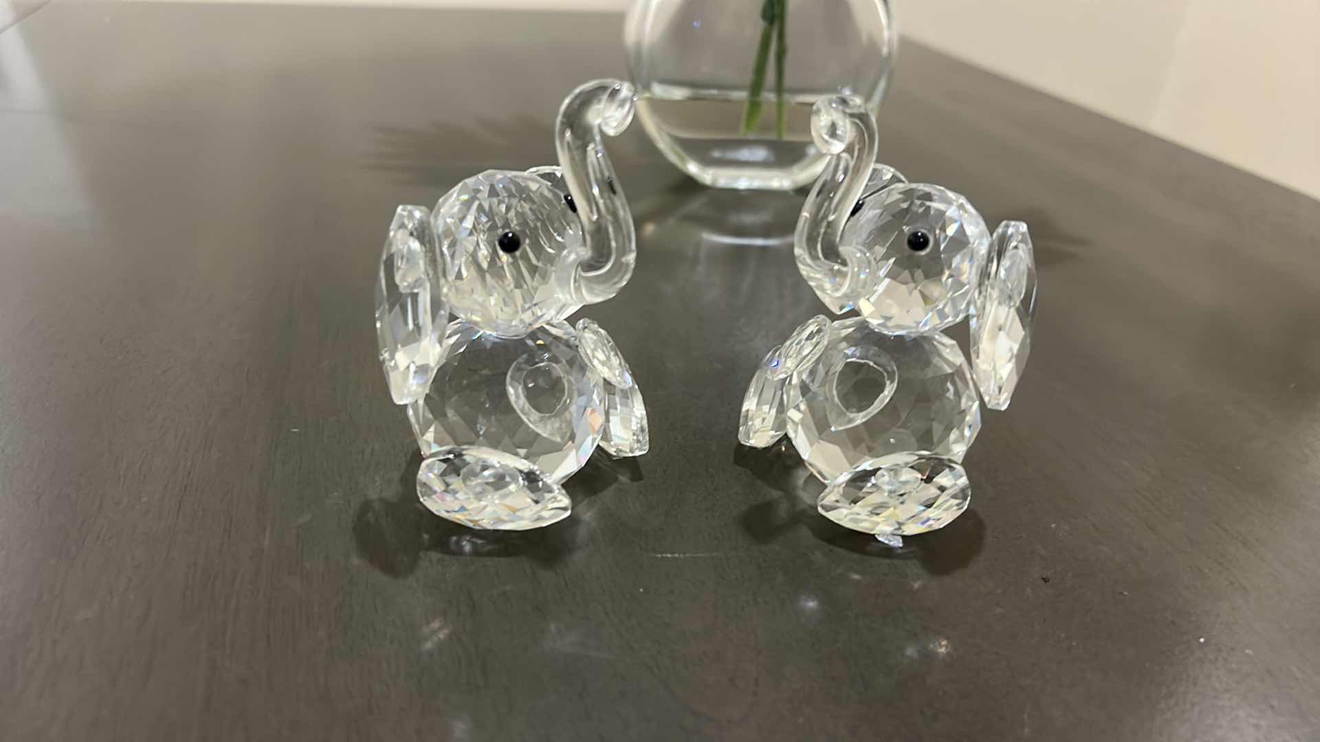Photo 1 of AMLONG CRYSTAL SITTING ELEPHANT FIGURINES, H3.5” & FAUX FLORAL ARRANGEMENT