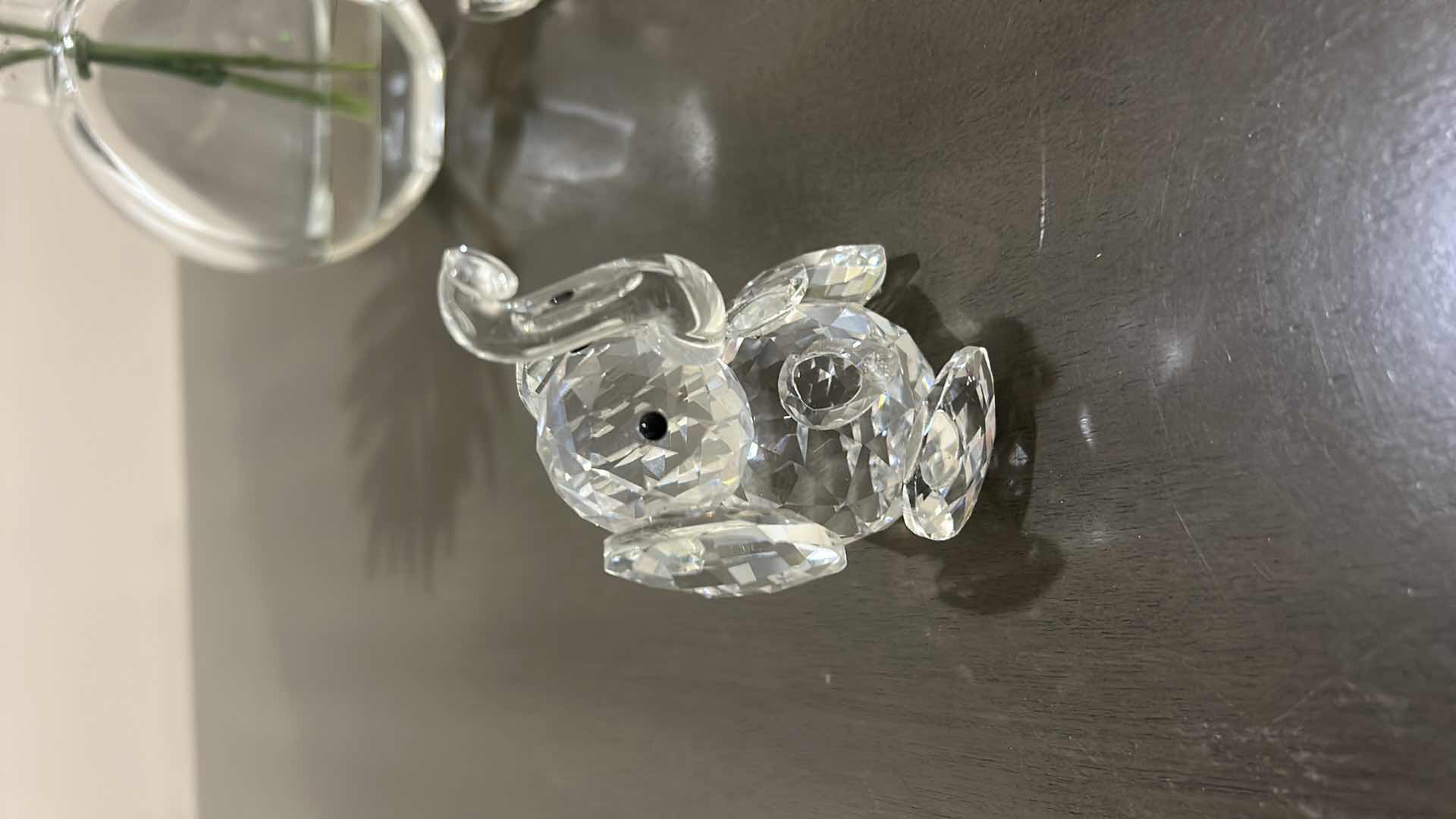 Photo 1 of AMLONG CRYSTAL SITTING ELEPHANT FIGURINES, H3.5” & FAUX FLORAL ARRANGEMENT