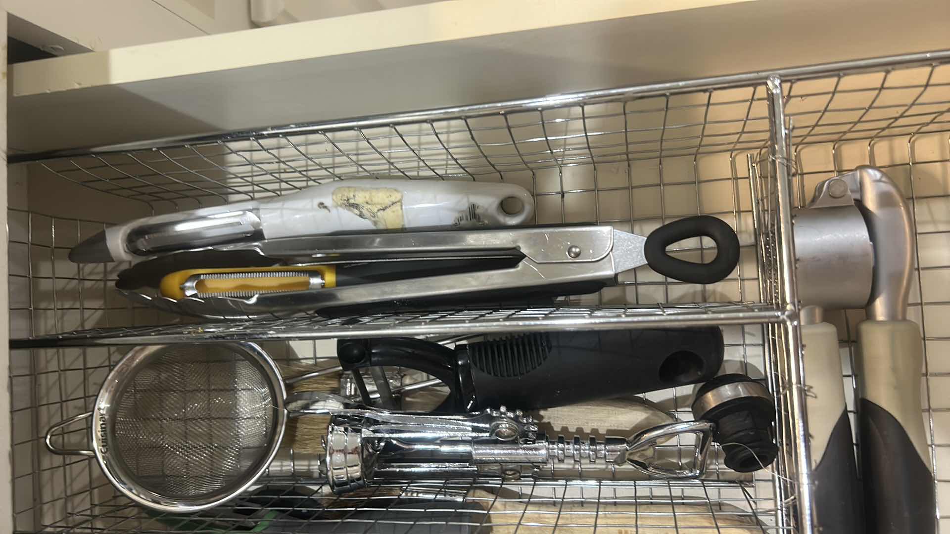 Photo 1 of CONTENTS OF DRAWER IN KITCHEN CAN OPENER BOTTLE OPENERS CHEESE, GRATER, AND