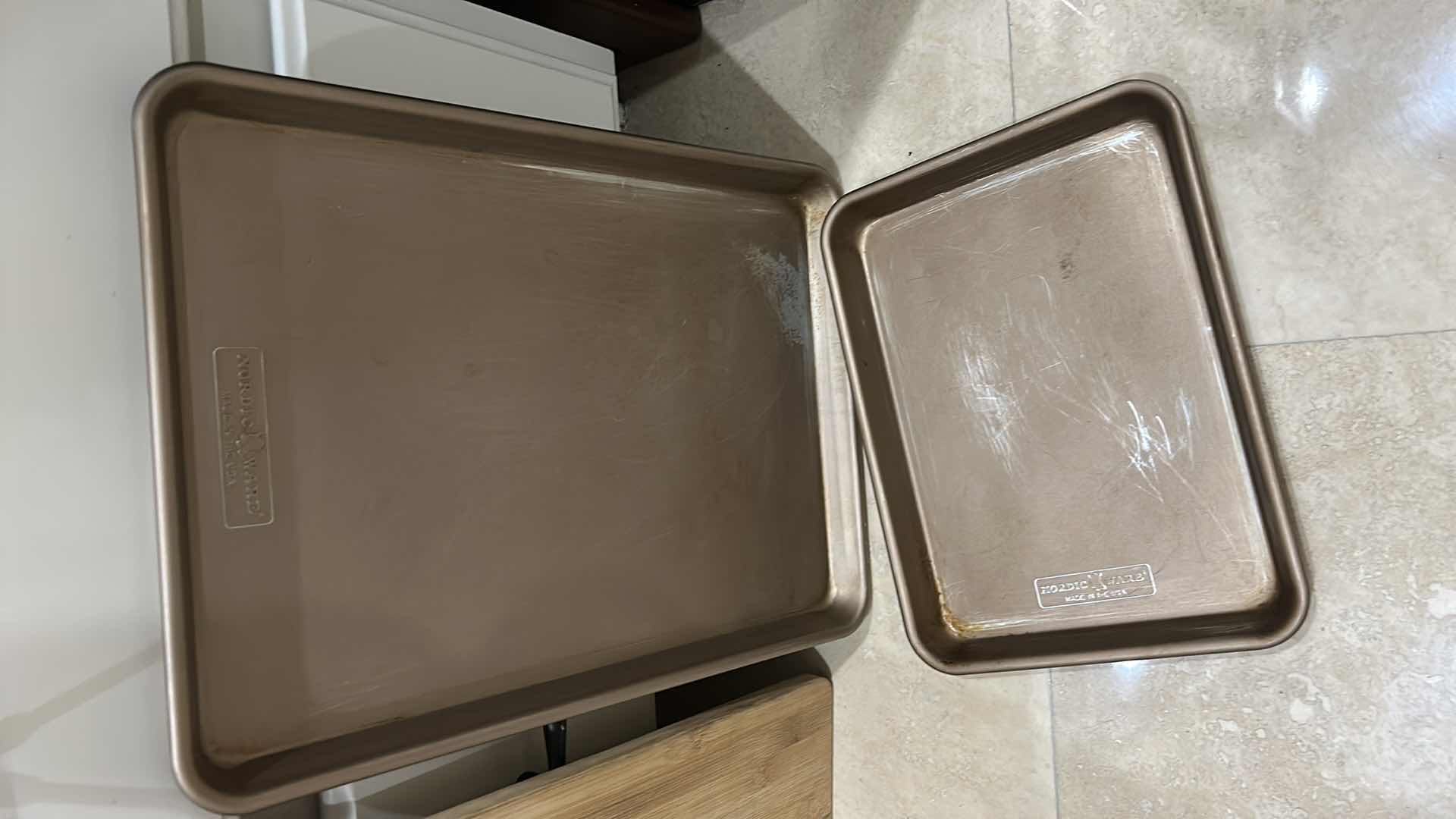 Photo 1 of CONTENTS OF CABINET IN KITCHEN, CUTTING BOARDS BAKING TRAYS