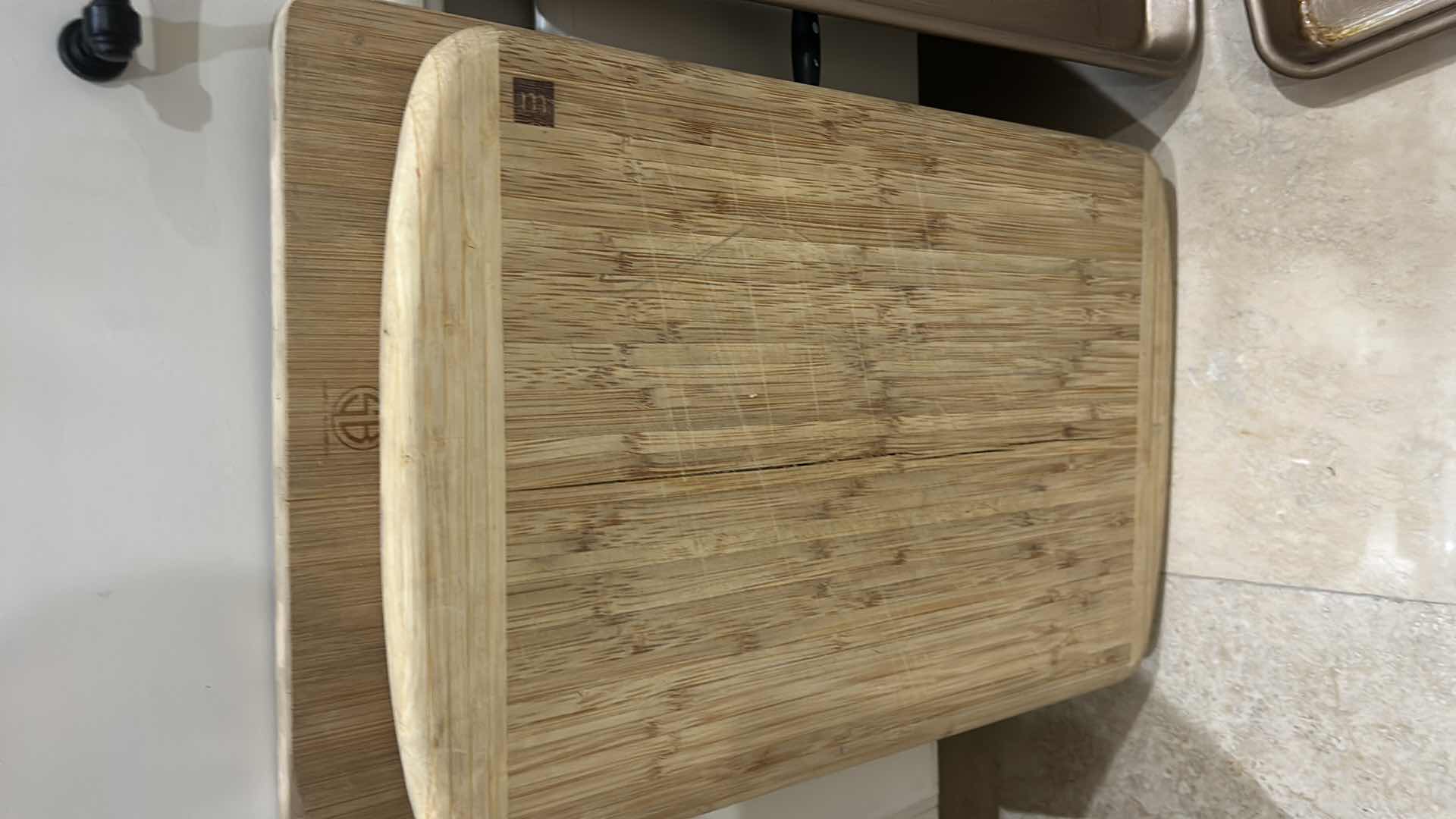 Photo 1 of CONTENTS OF CABINET IN KITCHEN, CUTTING BOARDS BAKING TRAYS