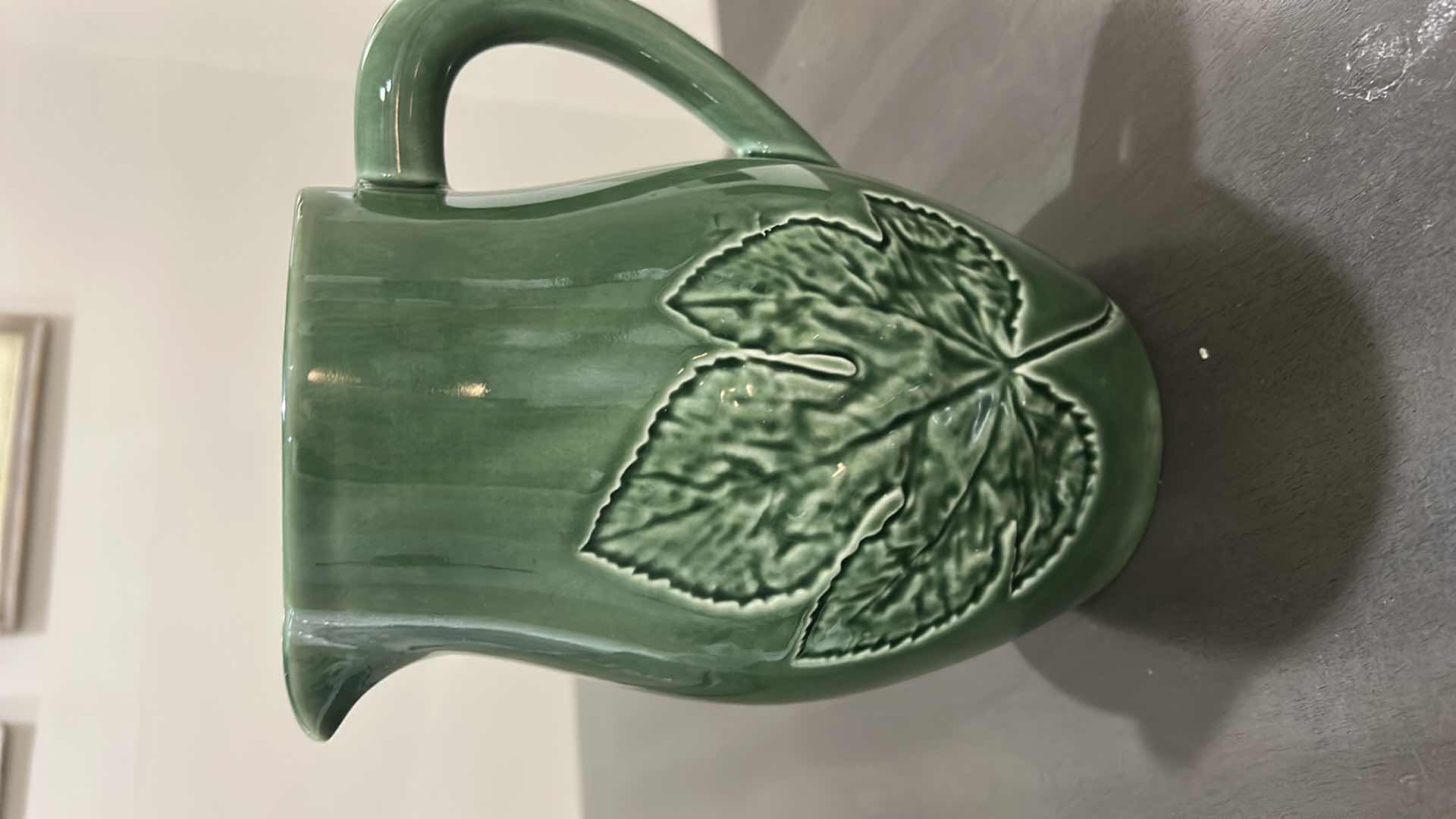 Photo 1 of GREEN CERAMIC PITCHER IS A BORDALLO PINHEIRO MAJOLICA PIECE FROM PORTUGAL FEATURING AN EMBOSSED MAPLE LEAF DESIGN.