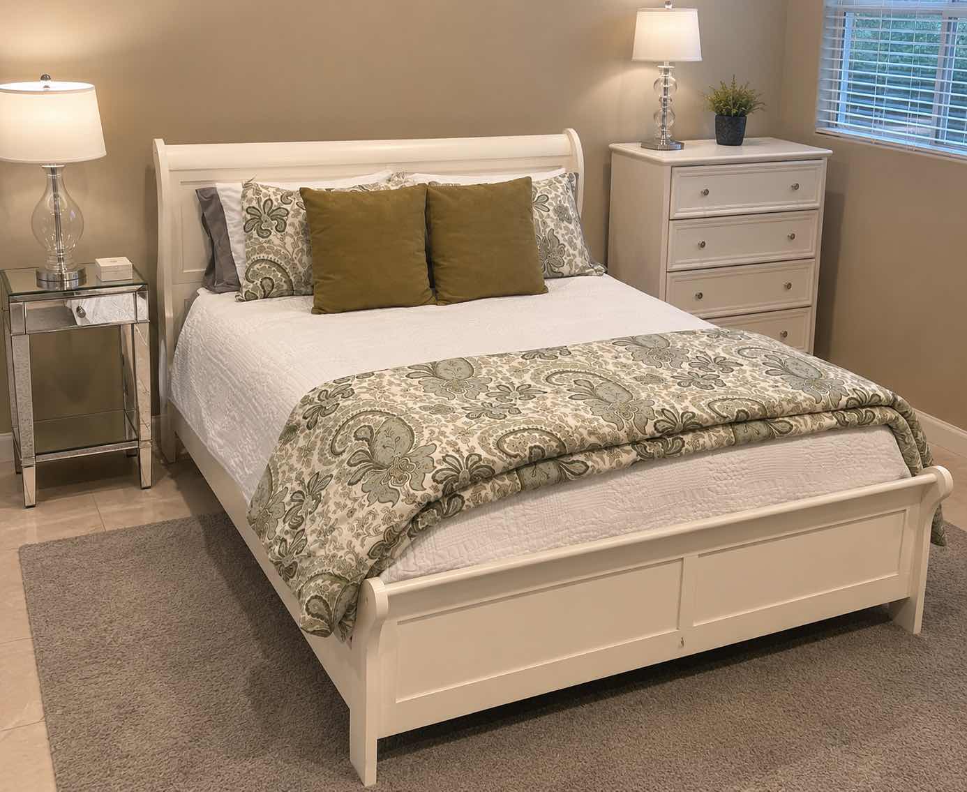 Photo 1 of WHITE SLEIGH BED FRAME FEATURING A CURVED HEADBOARD AND FOOTBOARD, SEALY QUEEN MATTRESS, & BEDDING (HEADBOARD HEIGHT 43”
