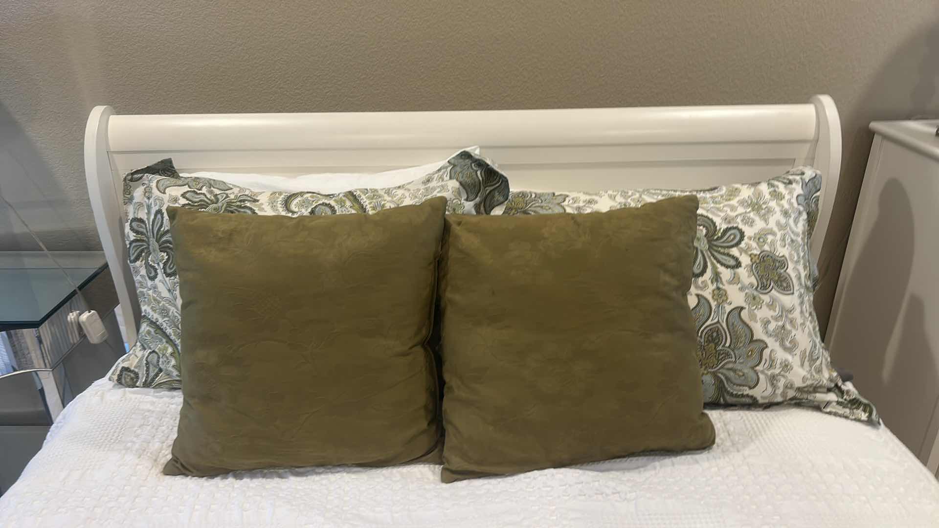 Photo 1 of WHITE SLEIGH BED FRAME FEATURING A CURVED HEADBOARD AND FOOTBOARD, SEALY QUEEN MATTRESS, & BEDDING (HEADBOARD HEIGHT 43”
