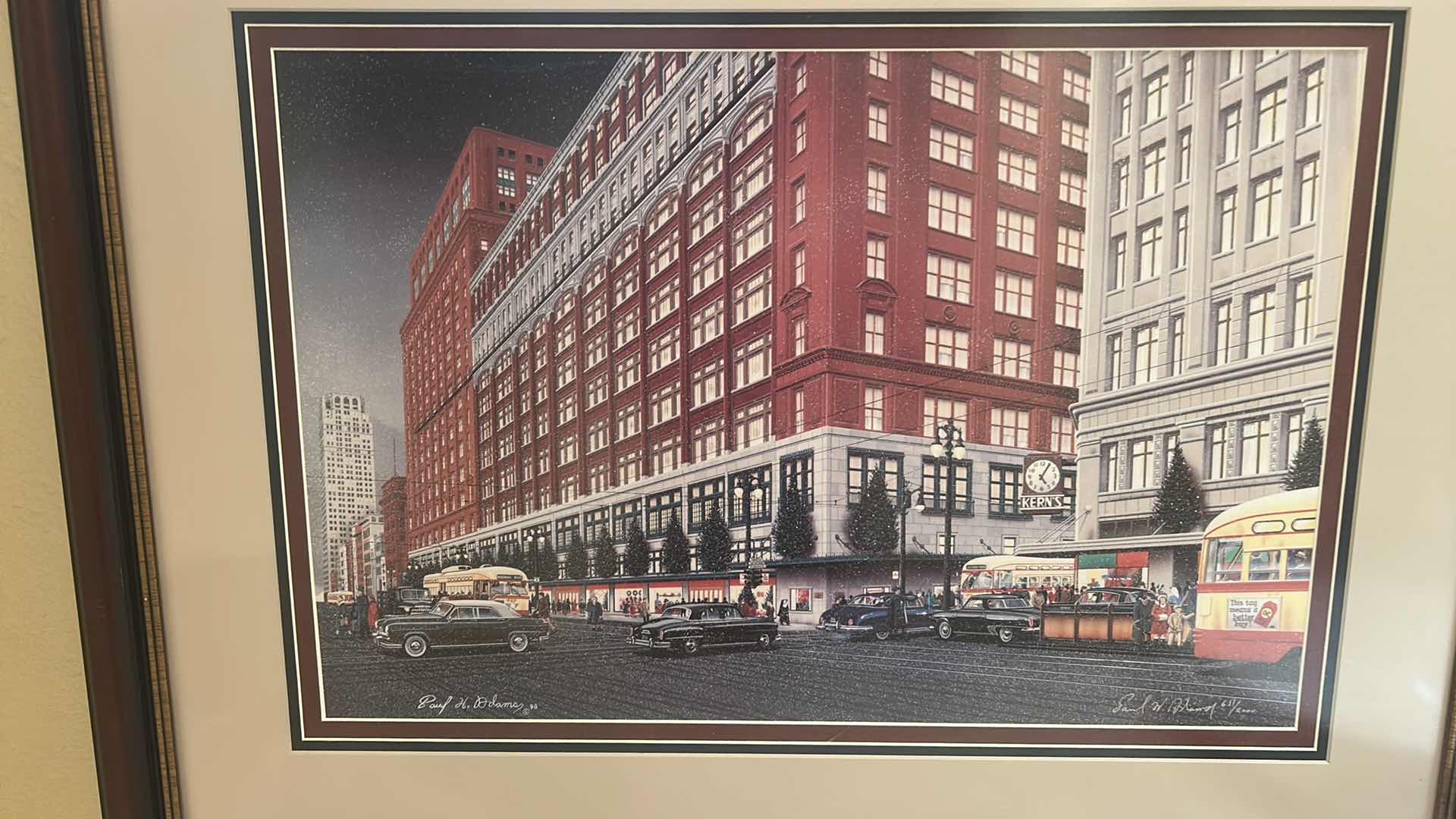 Photo 1 of FRAMED ART PRINT DEPICTS THE J.L. HUDSON DEPARTMENT STORE IN DETROIT, MICHIGAN, SHOWCASING THE ICONIC BUILDING DURING THE CHRISTMAS SEASON OF 1951. 35 1/4” x H27 1/4” ARTWORK