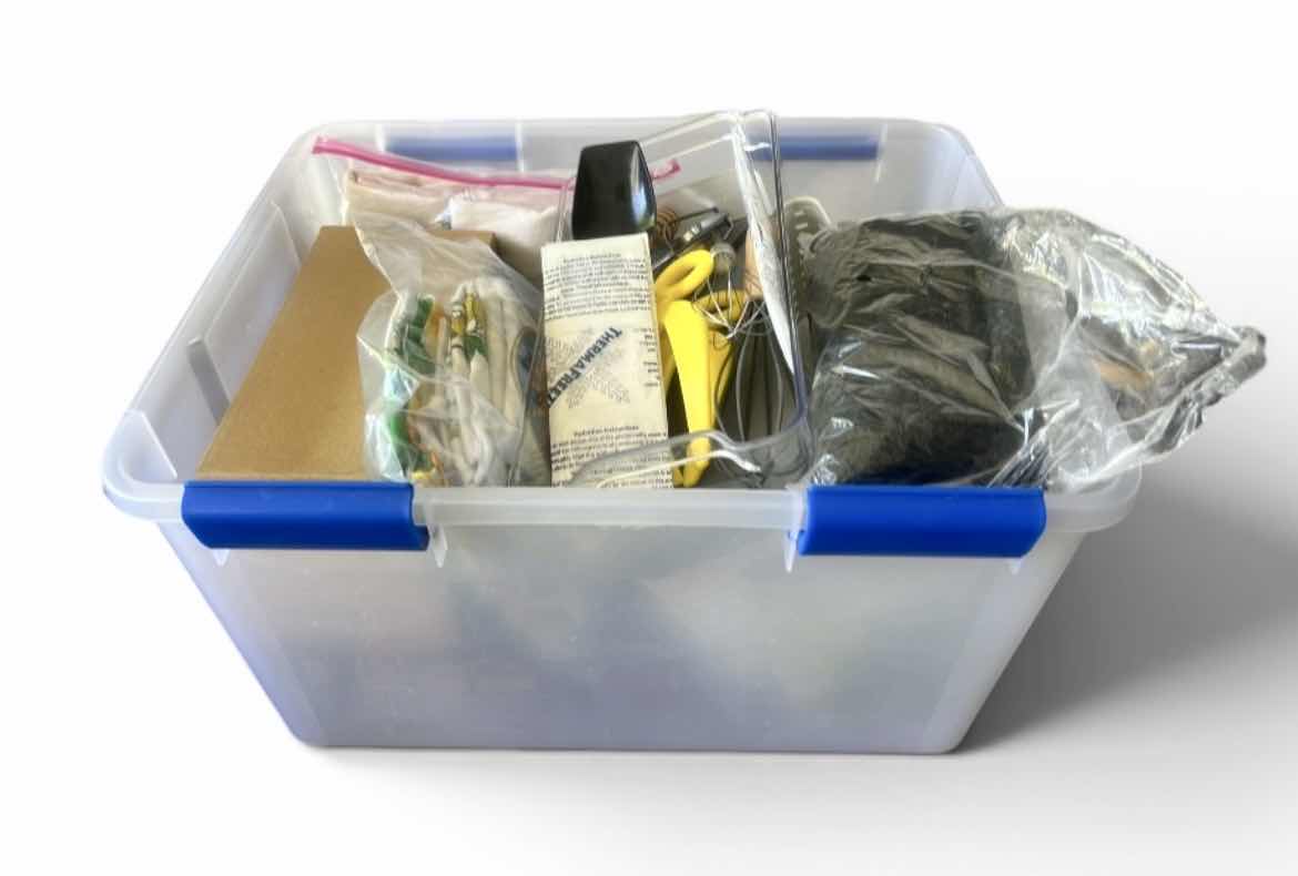 Photo 1 of ASSORTED CRAFT, SEWING, AND HOUSEHOLD SUPPLIES INCLUDING SCISSORS, THREAD, FABRIC, CORDS, CLIPS, AND SMALL TOOLS IN A PLASTIC STORAGE TOTE.