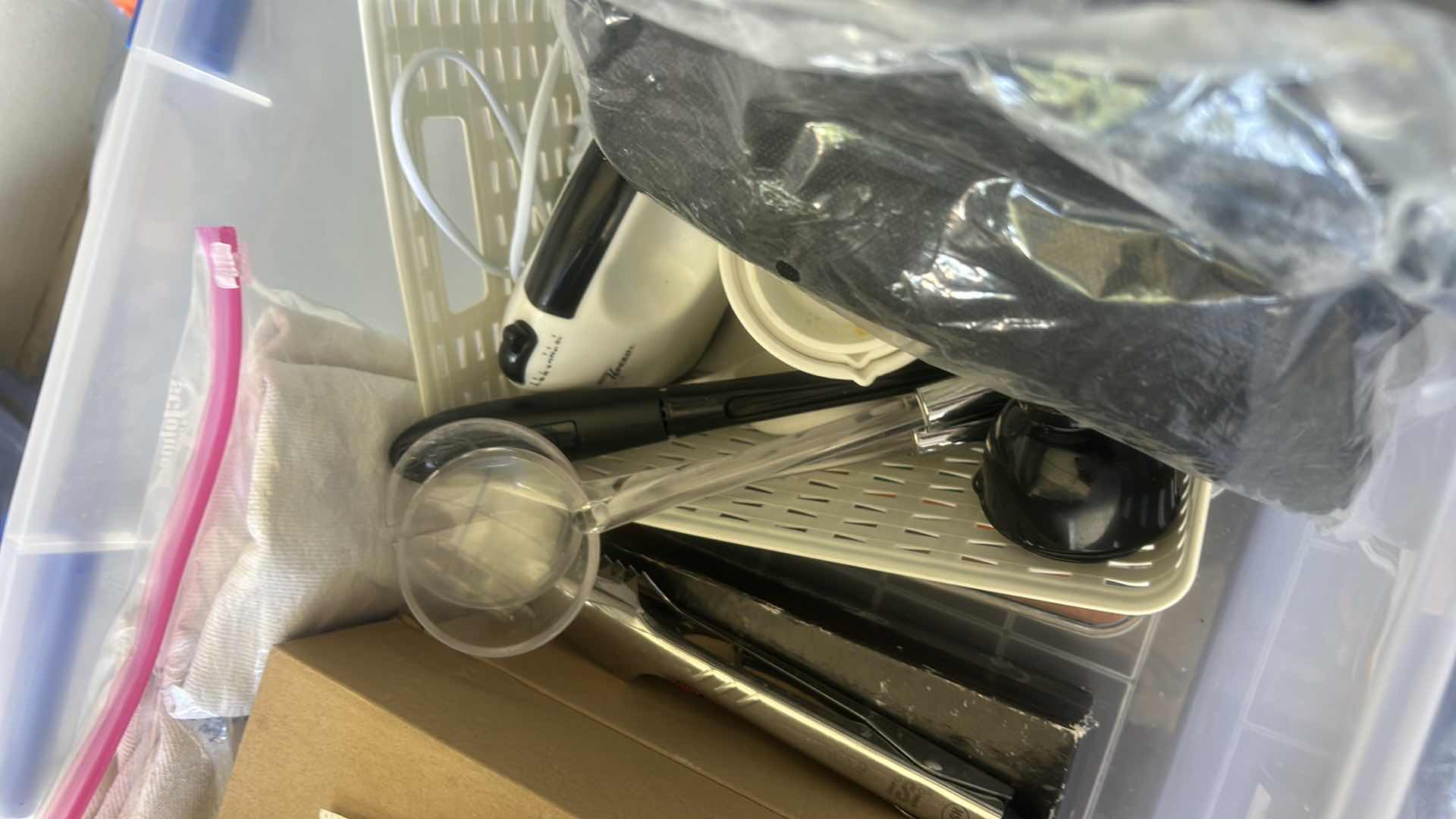 Photo 1 of ASSORTED CRAFT, SEWING, AND HOUSEHOLD SUPPLIES INCLUDING SCISSORS, THREAD, FABRIC, CORDS, CLIPS, AND SMALL TOOLS IN A PLASTIC STORAGE TOTE.