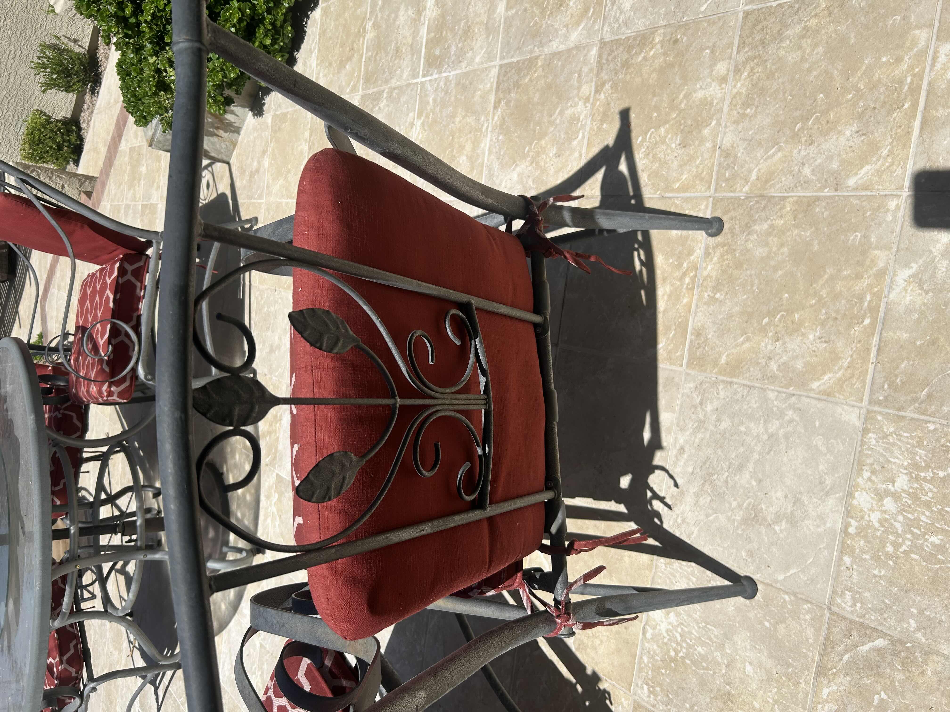 Photo 1 of RED GREY METAL OUTDOOR CHAIR W GEOMETRIC TRELLIS PATTERN ON CUSHIONS