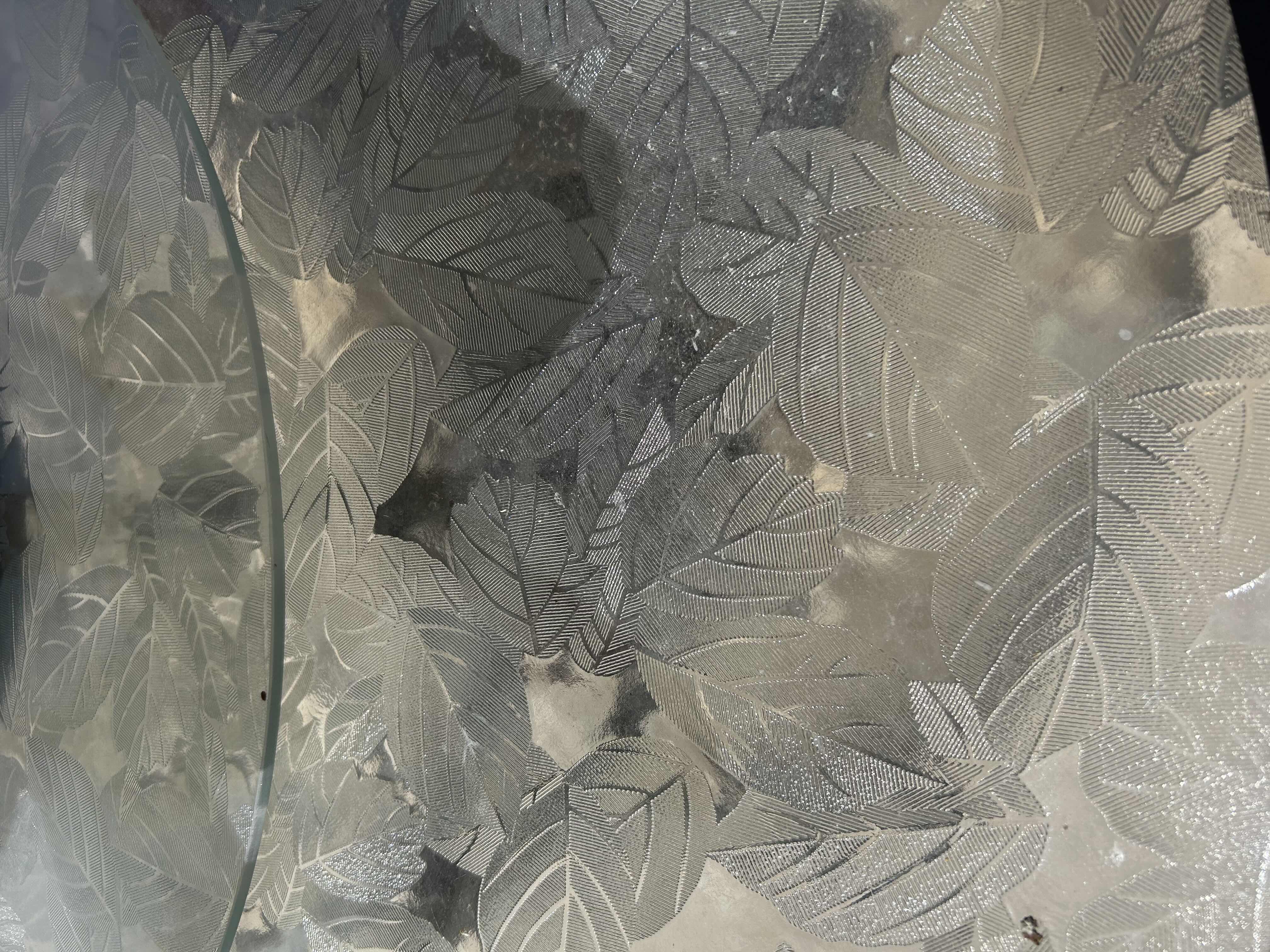 Photo 1 of GREY PATIO DINING TABLE W CIRCULAR GLASS TOP ETCHED W LEAF DESIGNS & INTEGRATED LASY SUSAN 60" CHAIRS SOLD SEPARATELY