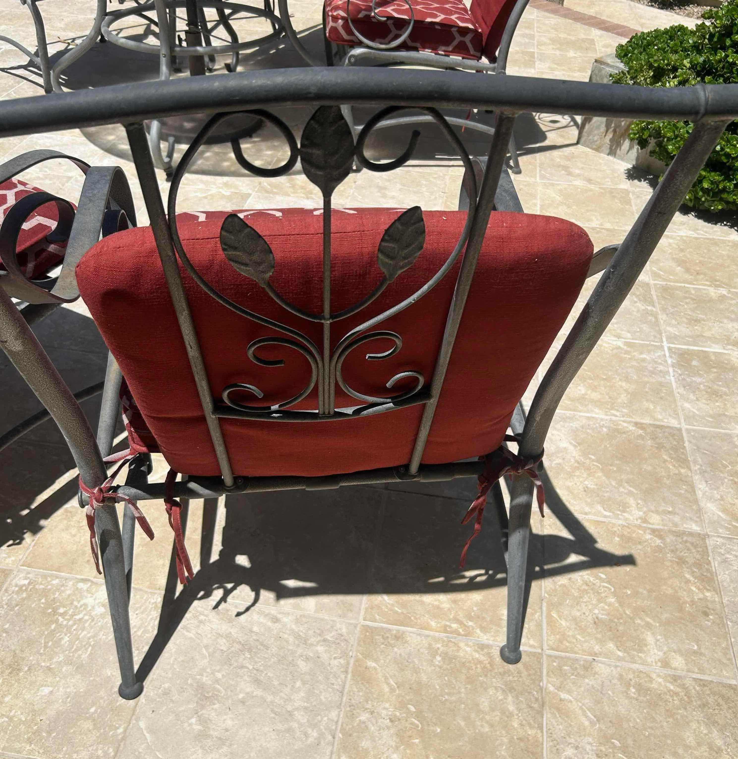 Photo 1 of RED GREY METAL OUTDOOR CHAIR W GEOMETRIC TRELLIS PATTERN ON CUSHIONS