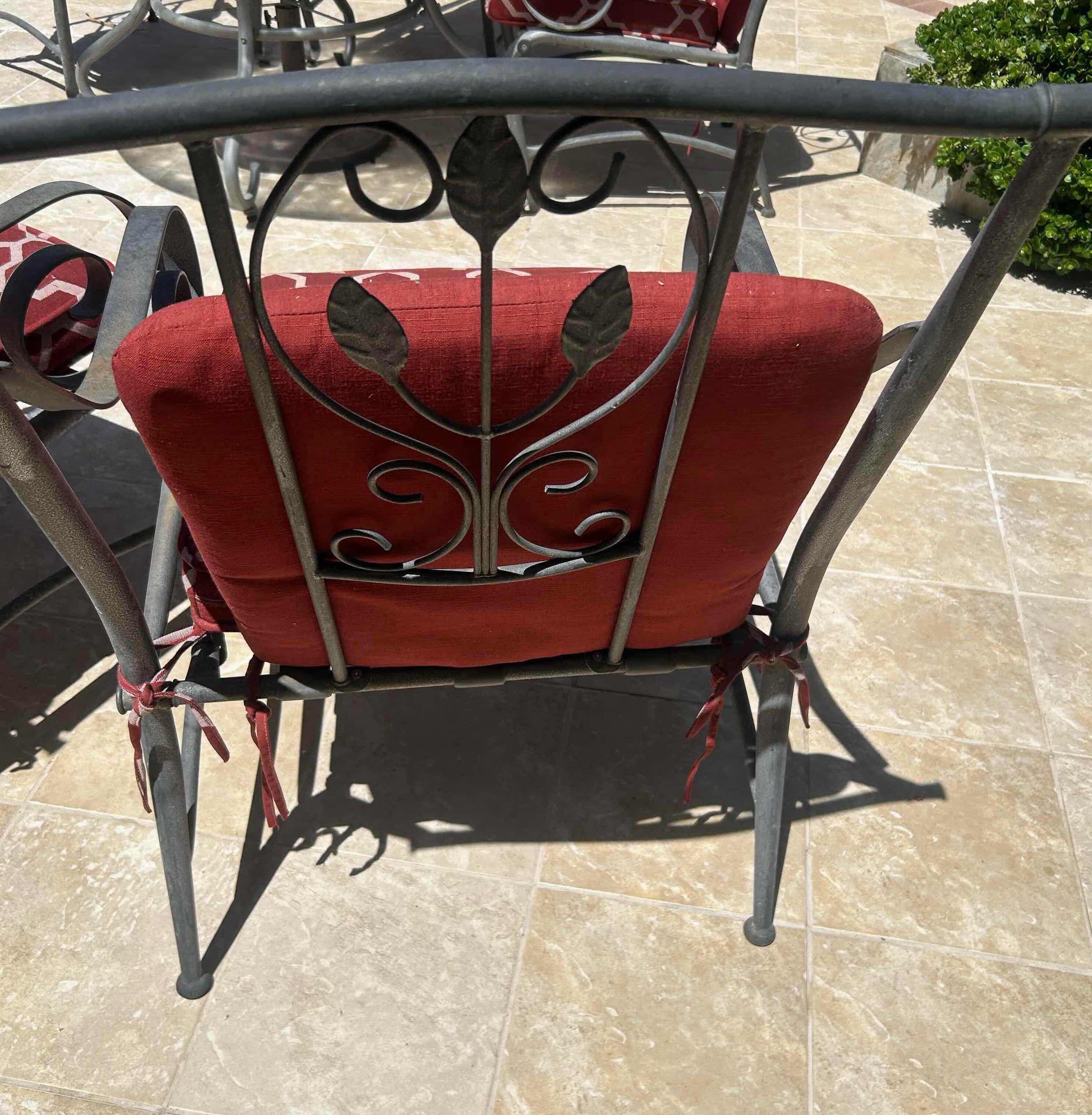 Photo 1 of RED GREY METAL OUTDOOR CHAIR W GEOMETRIC TRELLIS PATTERN ON CUSHIONS