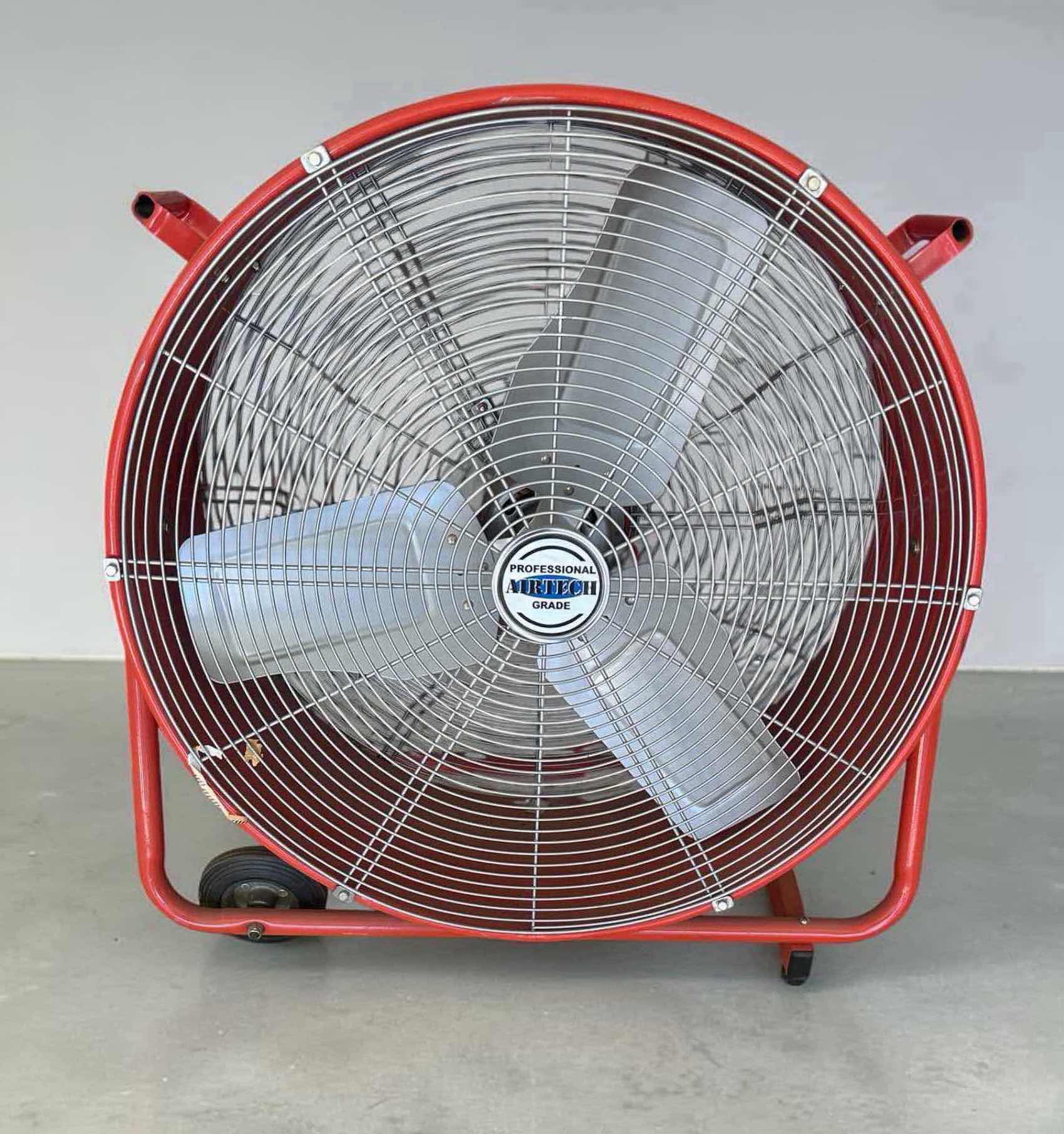 Photo 1 of RED INDUSTRIAL FLOOR DRUM FAN W PROTECTIVE METAL GRILLE BUILT IN WHEELS