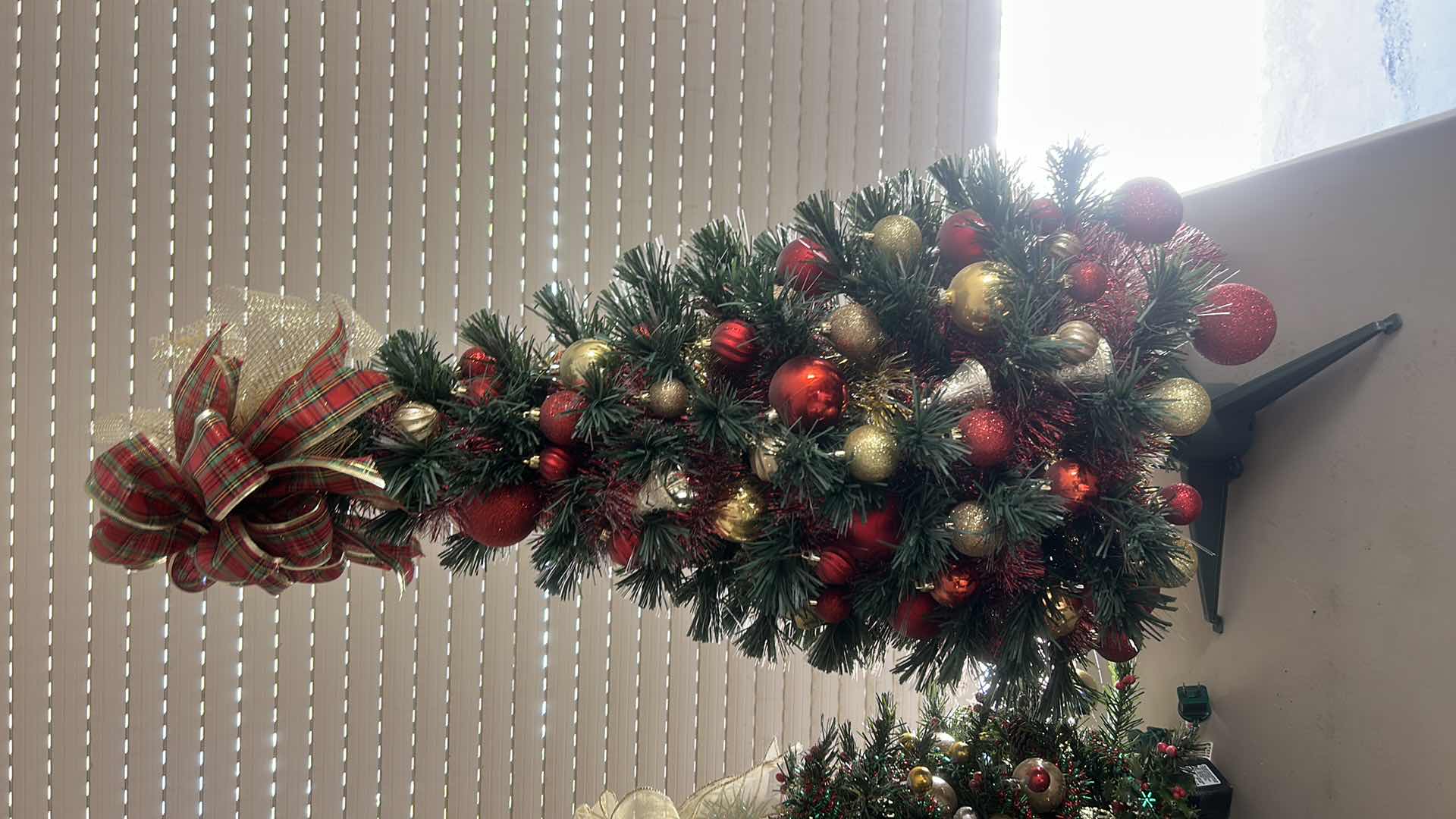 Photo 1 of DECORATED MINATURE CHRISTMAS TREE W RED PLAID BOW H32”