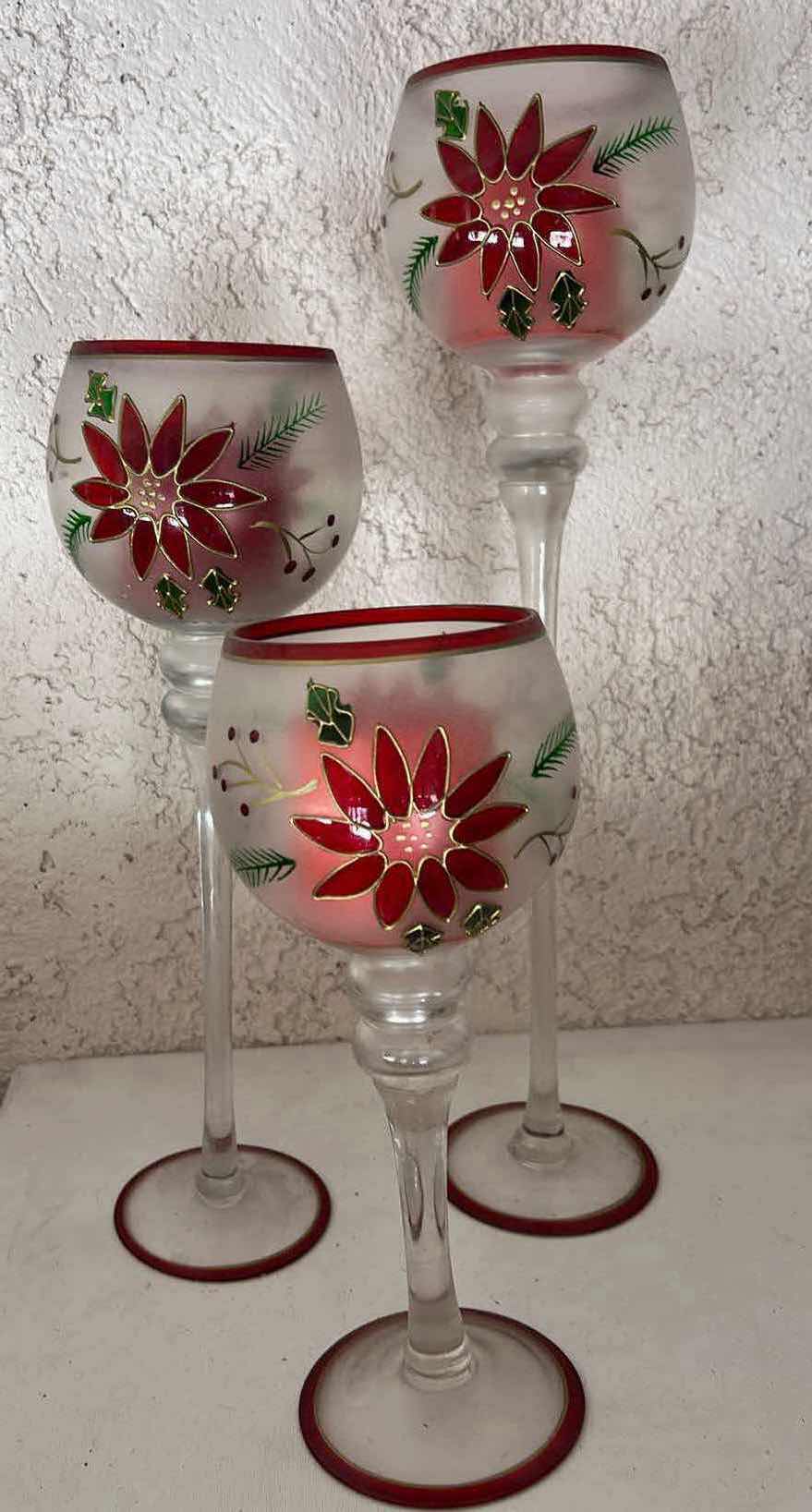 Photo 1 of DECORATIVE GLASS CHRISTMAS CANDLE HOLDERS, TALLEST H 20”