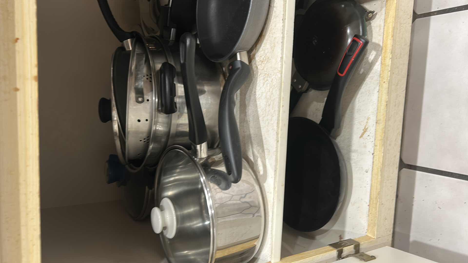 Photo 1 of CONTENTS OF CABINET POTS PANS