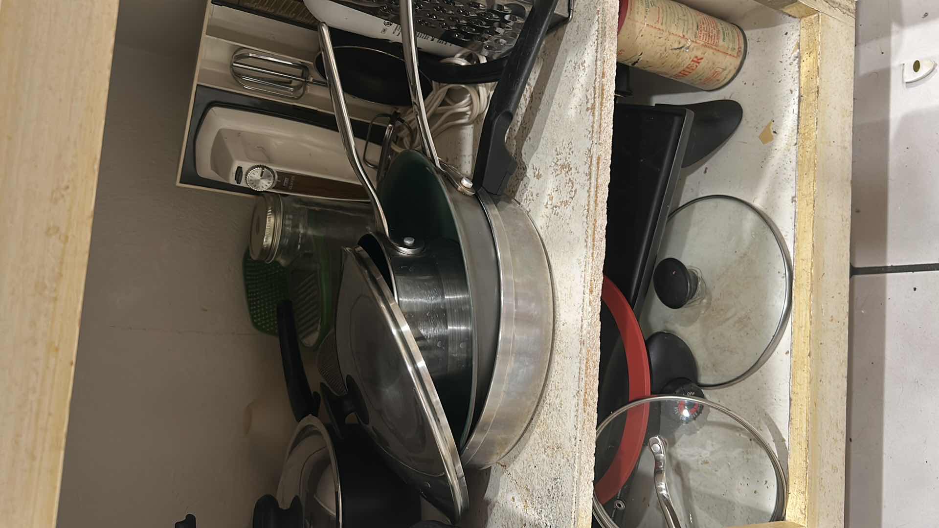 Photo 1 of CONTENTS OF CABINET POTS PANS