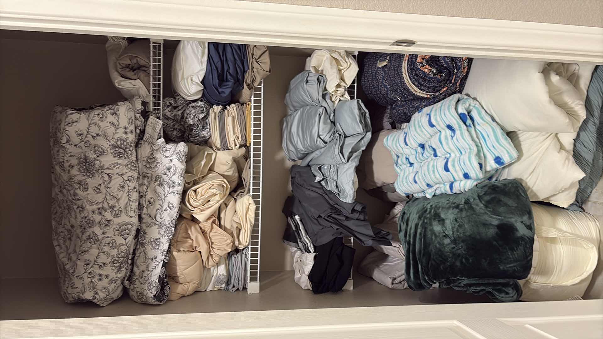 Photo 1 of CONTENTS OF PRIMARY BATHROOM LINEN CLOSET SIZE KING SHEETS, COMFORTERS, & MORE