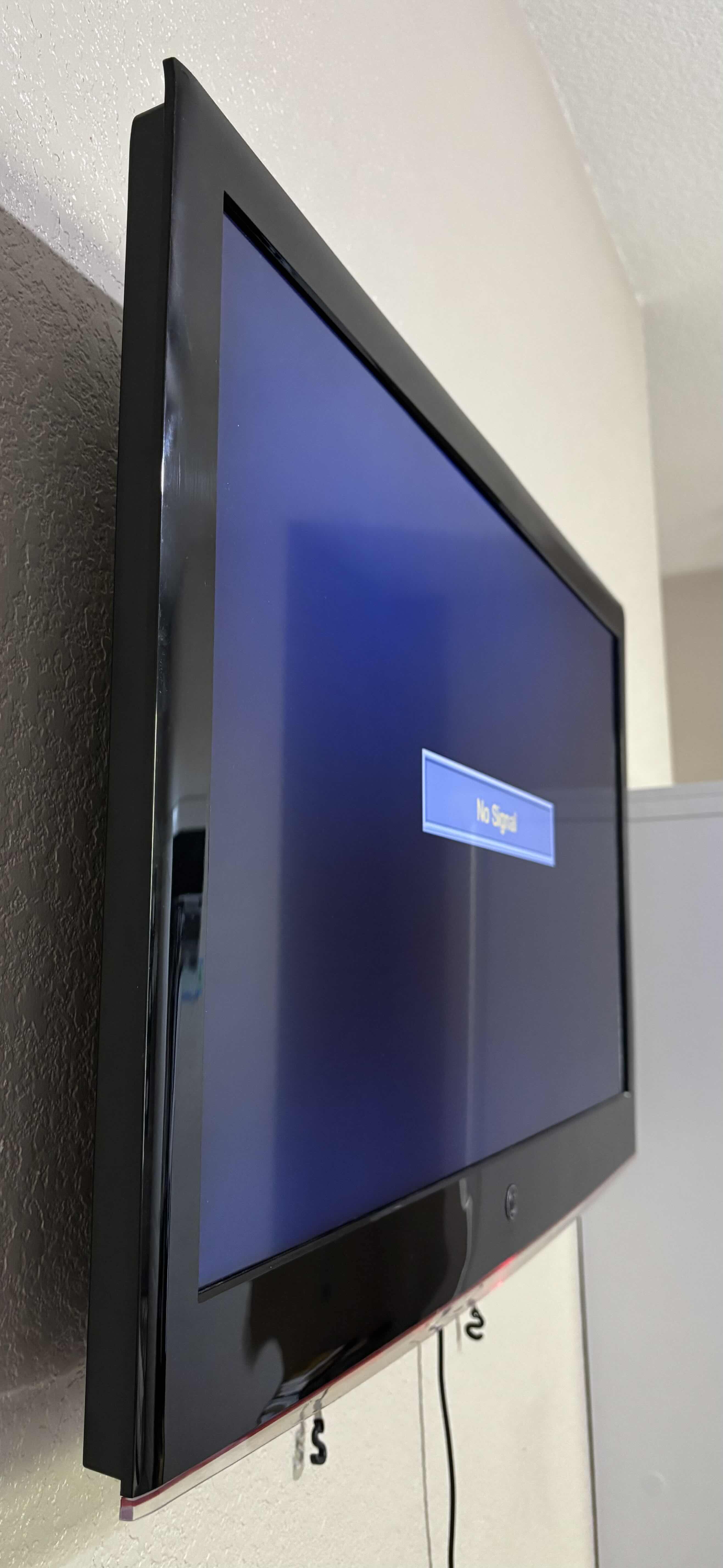 Photo 1 of 35” WALL MOUNTED WESTINGHOUSE FLAT SCREEN TV WITH ROKU REMOTE