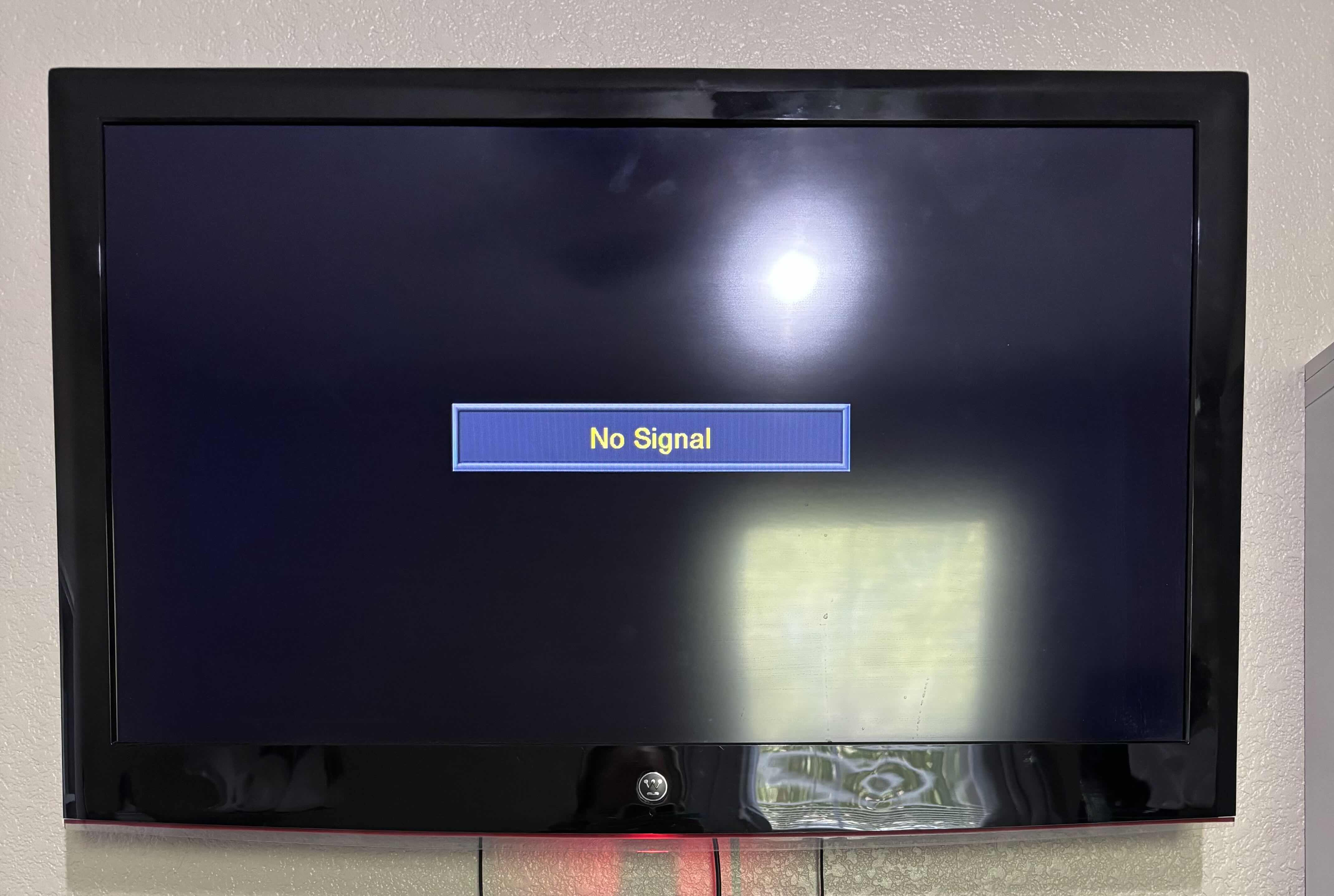 Photo 1 of 35” WALL MOUNTED WESTINGHOUSE FLAT SCREEN TV WITH ROKU REMOTE
