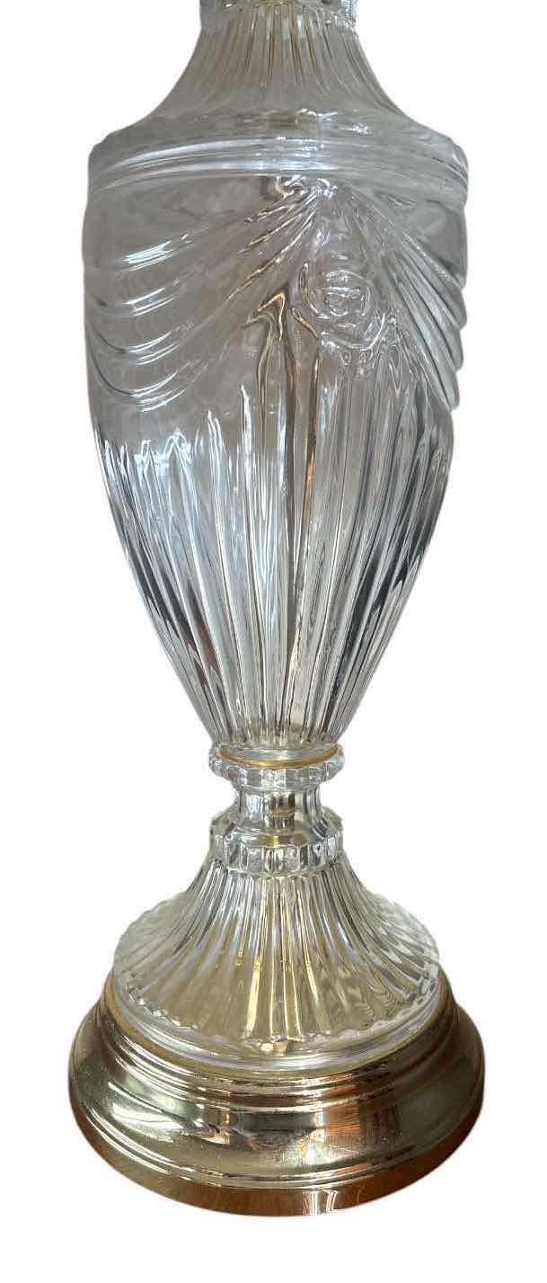View 2 of CLEAR GLASS TABLE LAMP WITH GOLD TONE BASE & WHITE FABRIC SHADE H29” $60
