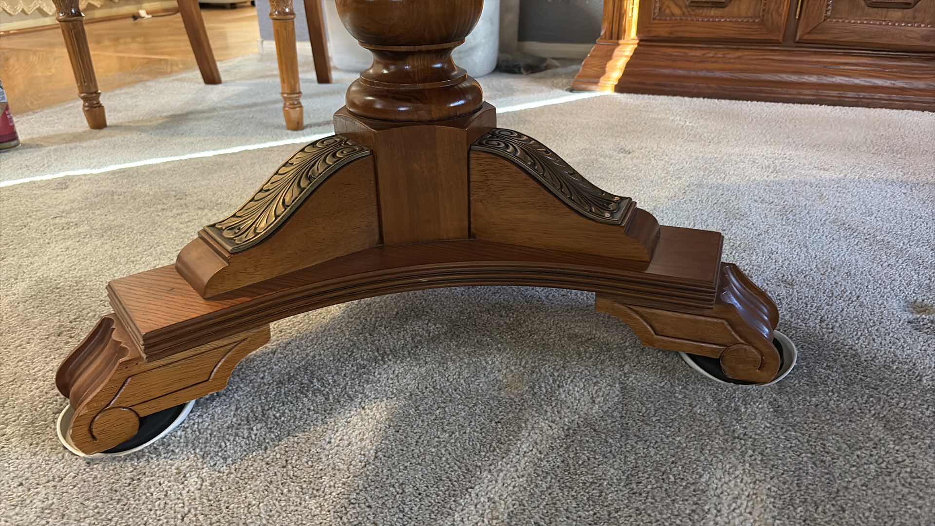View 2 of TRADITIONAL WOOD EXTENDABLE DINING TABLE WITH ORNATE PEDESTAL BASE – MEDIUM BROWN COMES W/TWO EXTENSION LEAVES AND FELT COVERS 84”X62”H29.5”