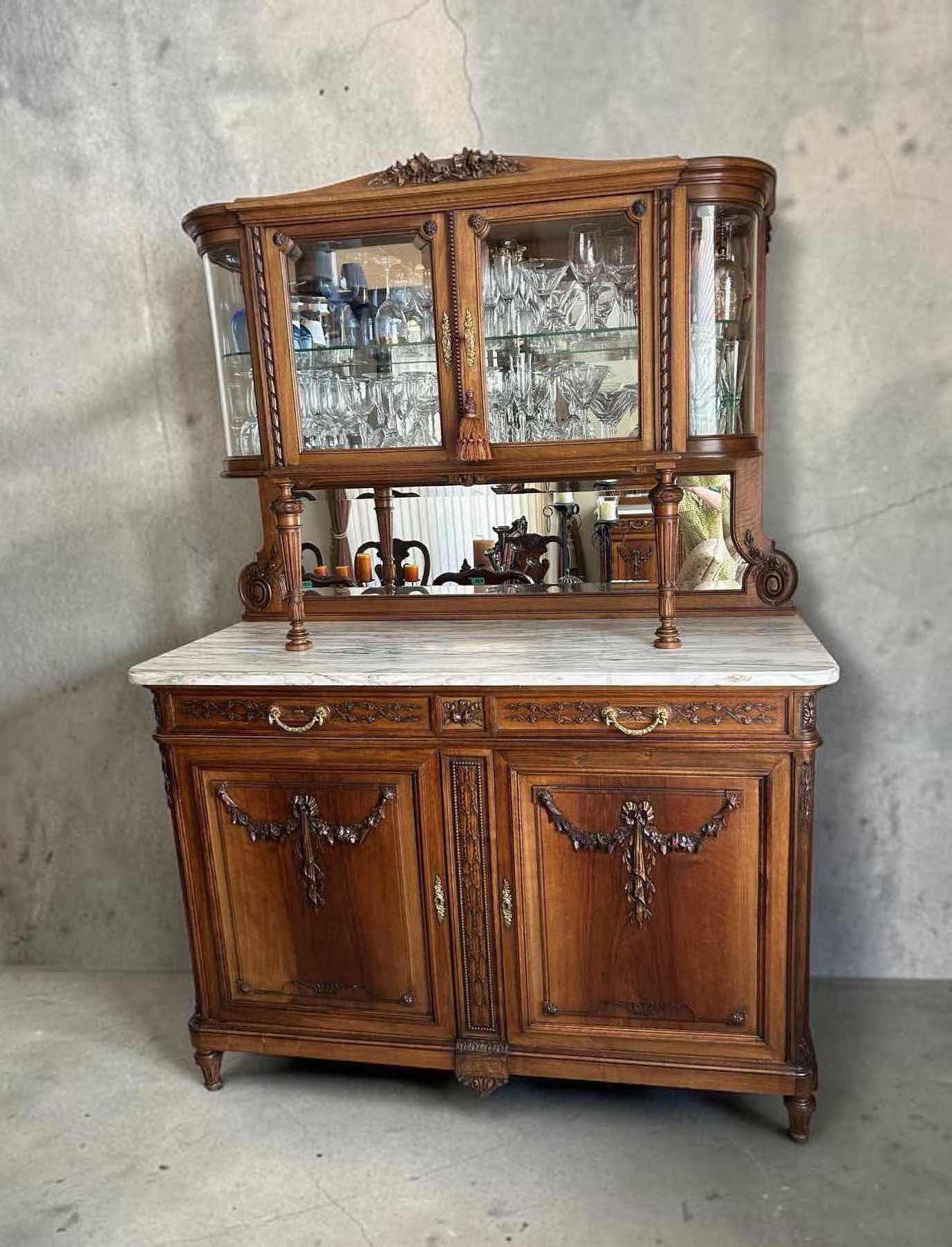 Photo 1 of ANTIQUE FRENCH WALNUT HUTCH W INTRICATE FLORAL CARVINGS & WHITE MARBLE TOP CURVED BEVELED GLASS DISPLAY 59" X 22" H 42" GLASSWARE NOT INCLUDED (SEE NOTES)