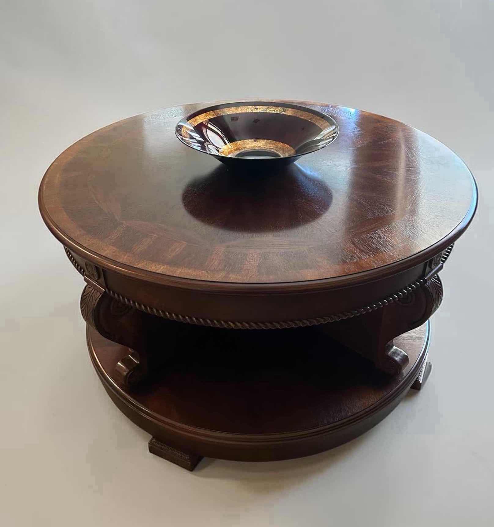 Photo 1 of MAHOGANY REEDED 41" ROUND SWIVEL COCKTAIL TABLE W INTRICATE REEDING AROUND BASE H 23" SEE NOTES
