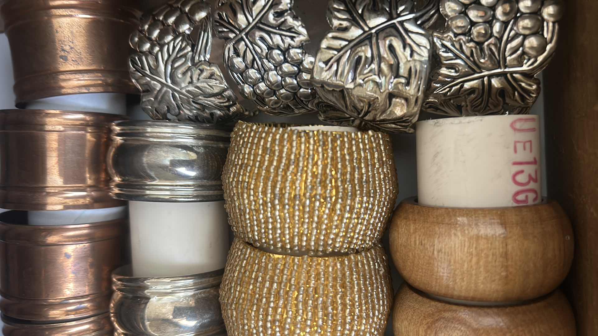 Photo 1 of CONTENTS OF DRAWER ASSORTMENT OF NAPKIN RINGS
