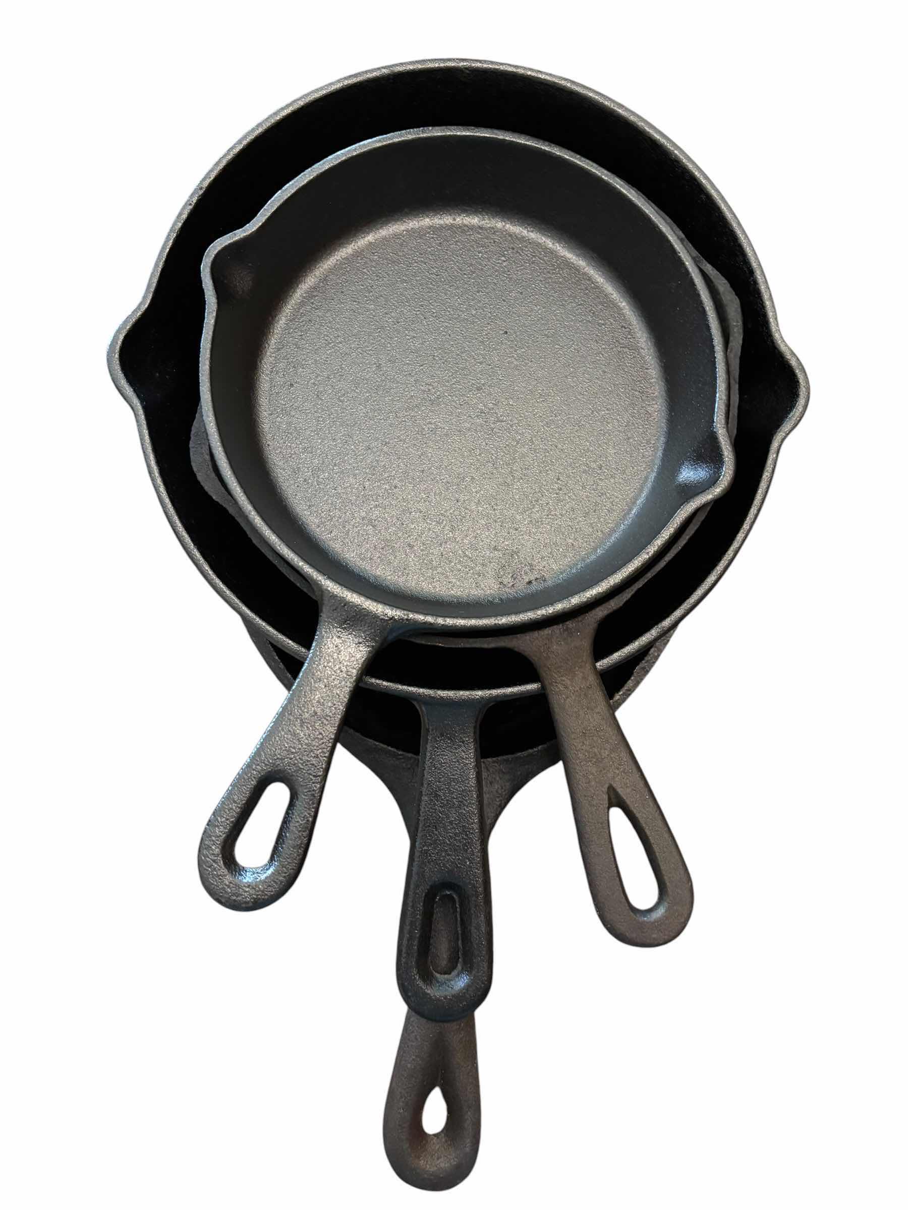Photo 1 of CAST IRON SKILLETS (4), SMALLEST 6.5”D & LARGEST 7” X 9.5”