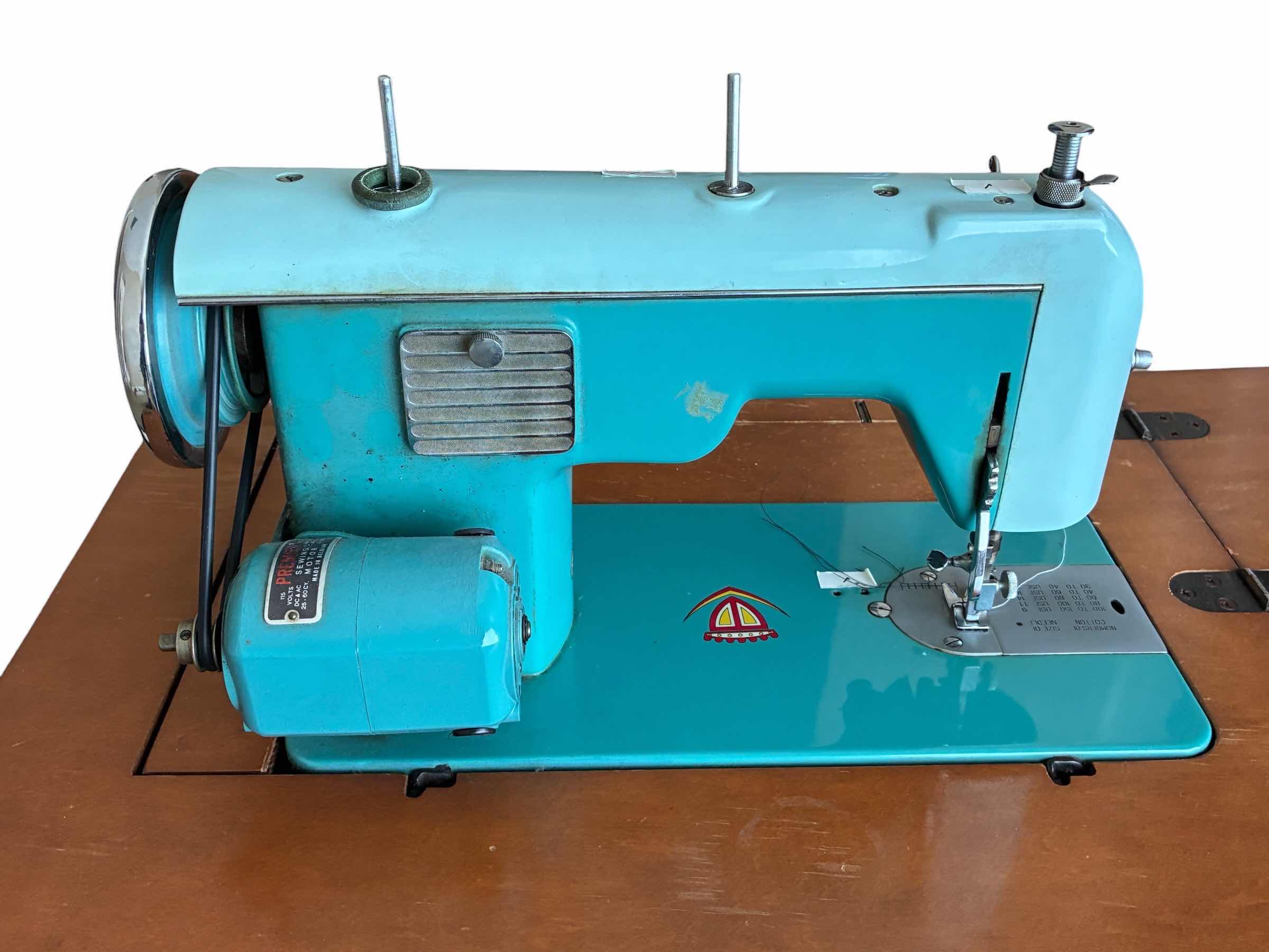 Photo 1 of DRESSMAKER ZIGZAG SEWING MACHINE 900 W WOOD STAND $350