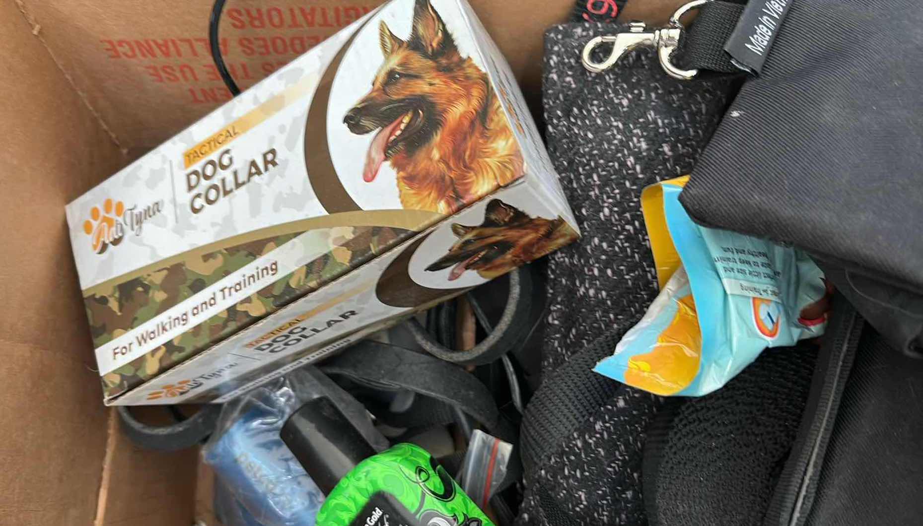 Photo 1 of BOX OF DOG ITEMS- LEASHES, BOWLS, POOP BAGS AND MORE