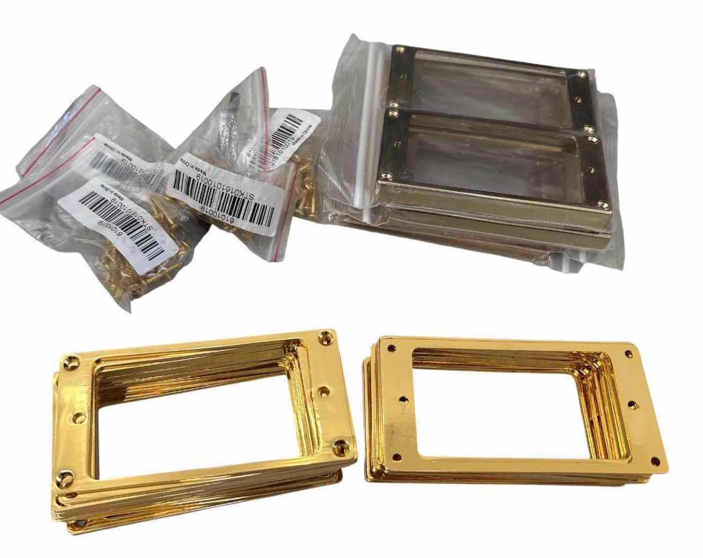 Photo 1 of ASSORTED GOLD-TONE & SMOKED HUMBUCKER GUITAR PICKUP MOUNTING RINGS W/ HARDWARE