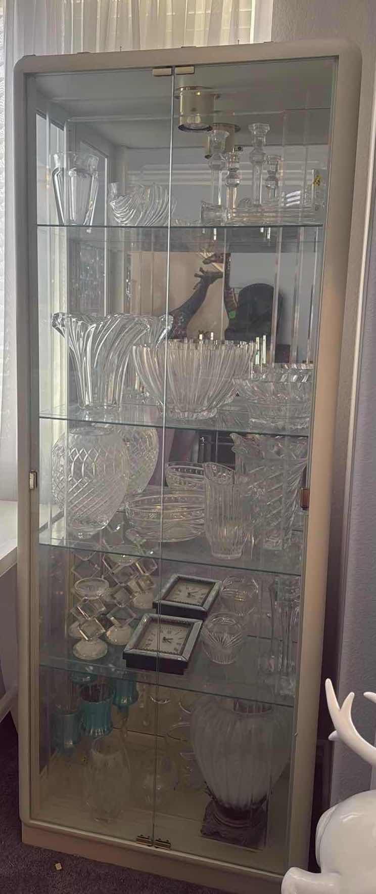 View 2 of LIGHTED BEVELED GLASS CURIO CABINET 29”x14” H78” (CONTENTS NOT INCLUDED)