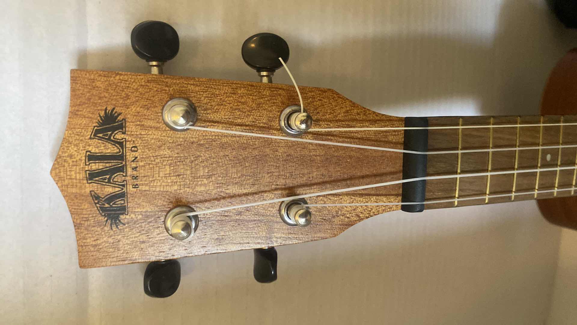 Photo 1 of WOOD CALLA UKULELE WITH STORAGE BAG