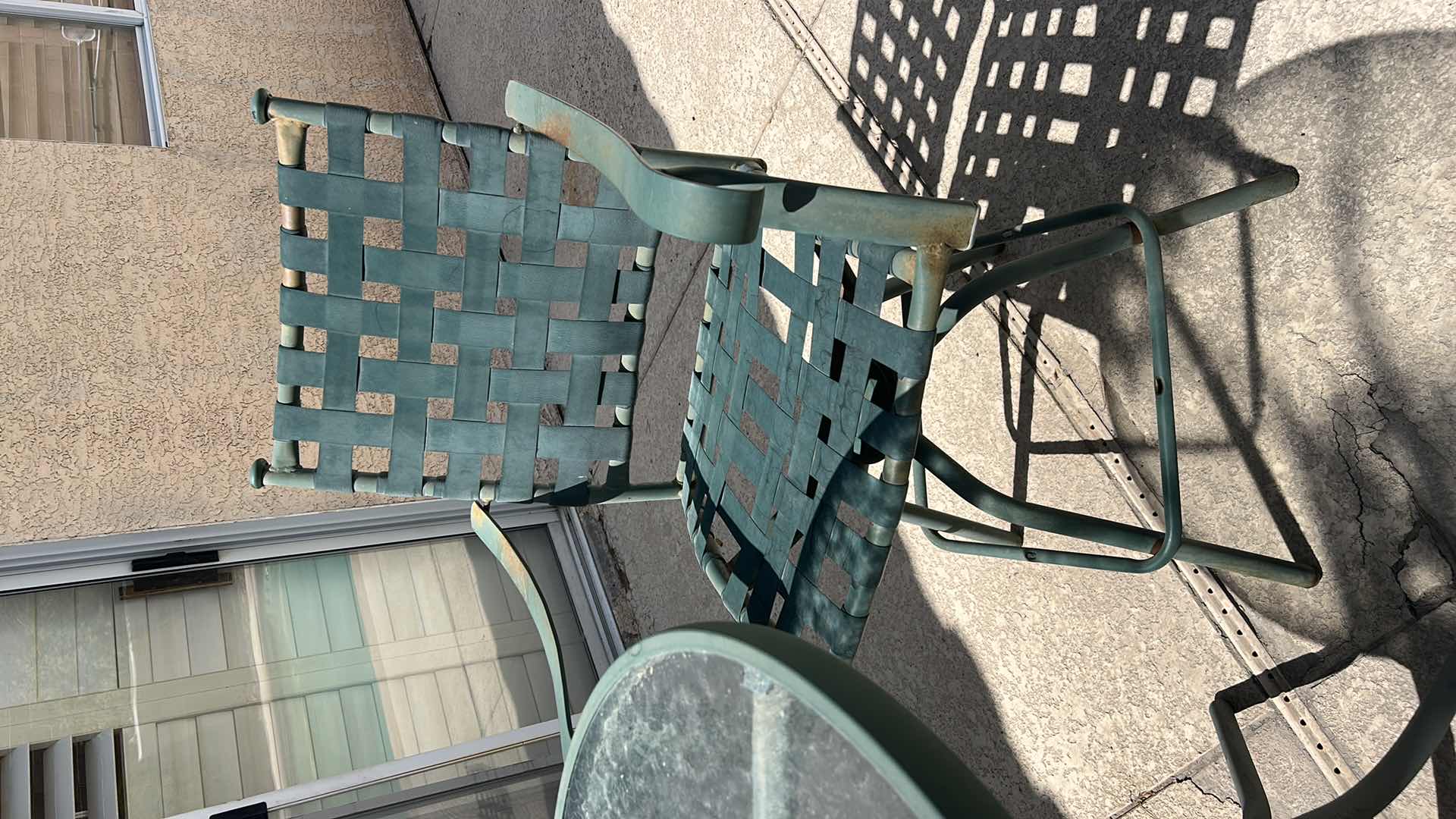 Photo 1 of METAL BAR HEIGHT OUTDOOR TABLE AND TWO CHAIRS WITH GREEN PATINA 28” X 28” X H 27 1/4” SEAT HEIGHT 26” OVERALL HEIGHT 43 1/2”
