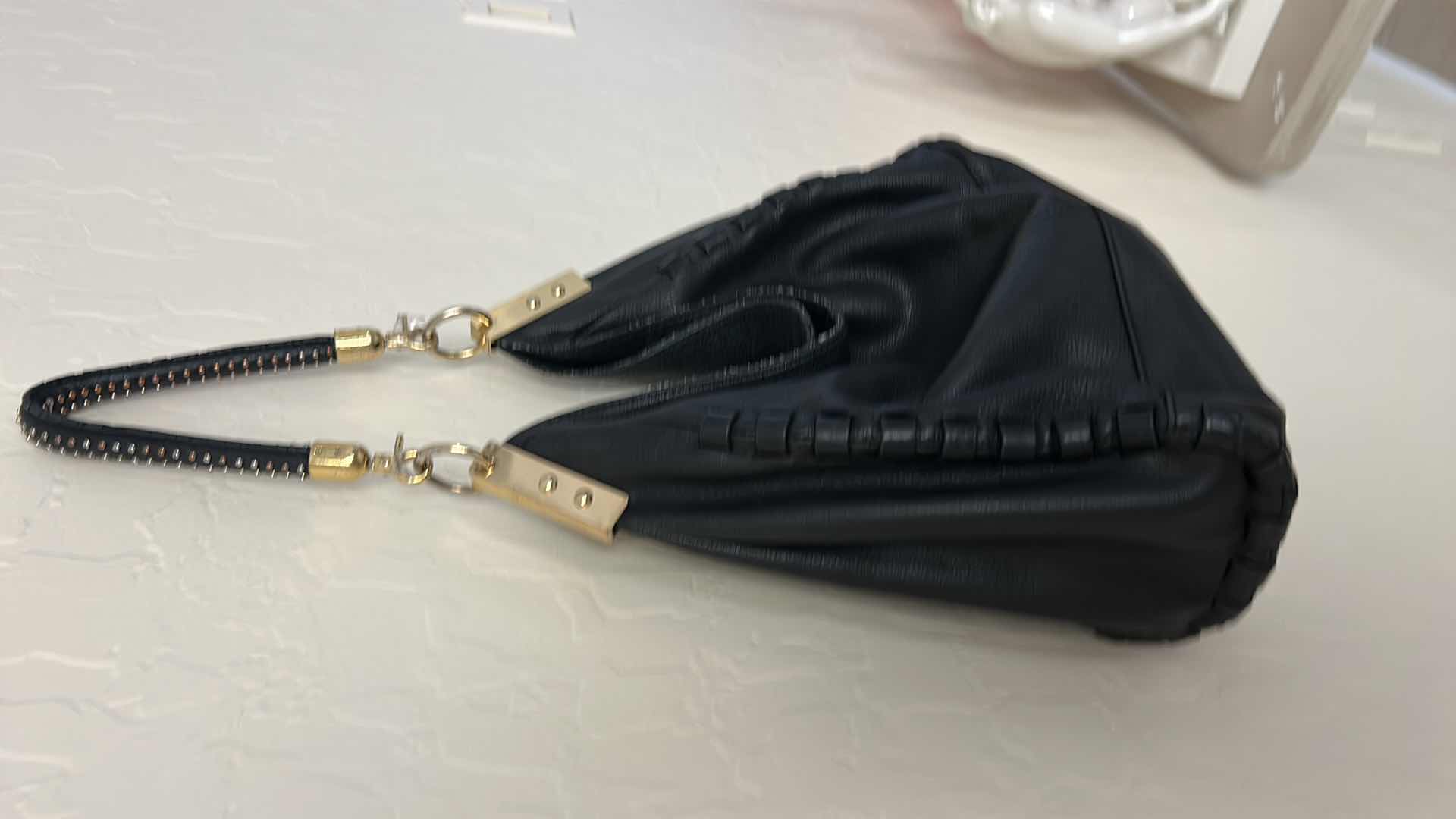 Photo 1 of VINCE CAMUTO, BLACK LEATHER, WHIPSTITCH HOBO BAG. $100