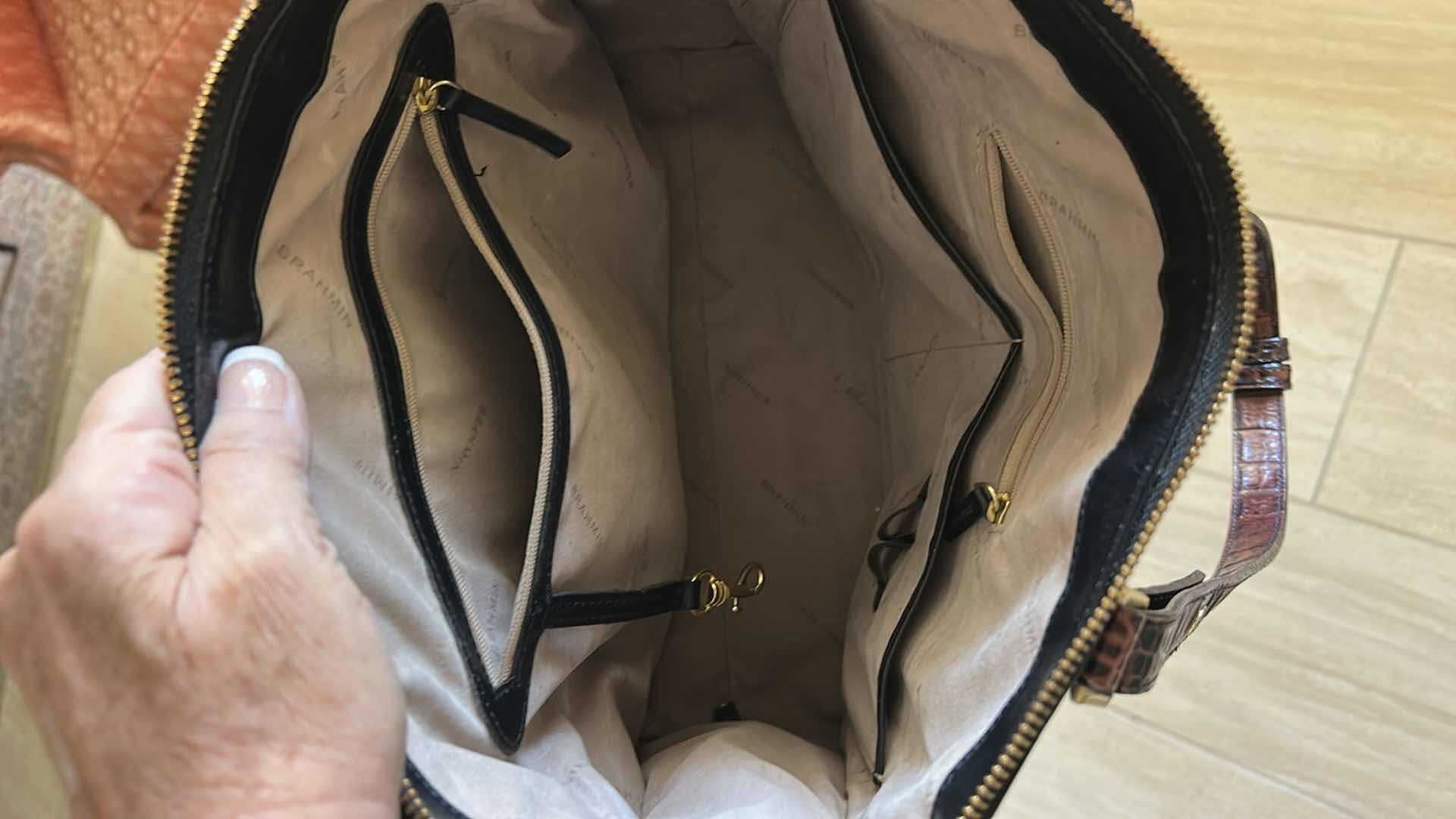 Photo 1 of BLACK LEATHER, BRAHMIN HANDBAG FEATURES, STRIKING, CROC, EMBOSSED CONTRAST TRIM, AND POLISHED GOLD TONE HARDWARE